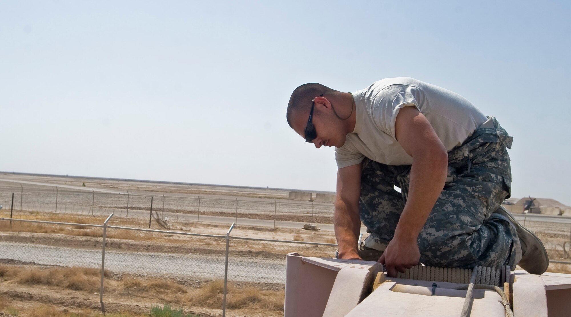ALI BASE, Iraq -- Senior Airman Aurelio Felix, 407th Expeditionary Logistics Readiness Squadron vehicle maintainer, performs maintenance on a crane July 30, 2008. The vehicle maintenance shop here maintains all Air Force vehicle assets, more than 300 vehicles and other heavy machinery. Airman Felix is deployed from Royal Air Force Mildenhall, England. (U.S. Air Force photo/Airman 1st Class Christopher Griffin)