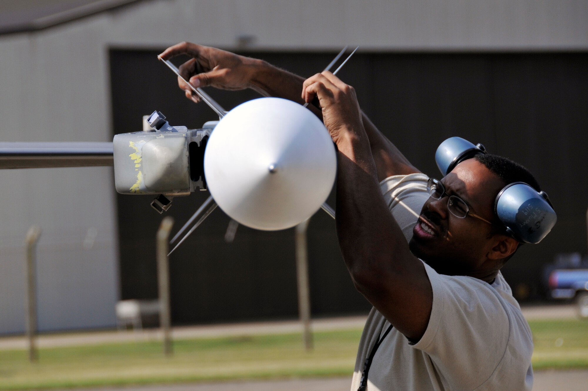 Master Sgt. Sean Murray, 52nd Aircraft Maintence Squadron, checks that an AIM-9 Sidewinder is properly secured to the wing of an F-16CJ from the 23rd Fighter Squadron July 24 at RAF Lakenheath, Engalnd. The F-16 was participating in Operation Northern Fury and was delayed here because of mechanical problems. (U.S. Air Force photo by Airman Perry Aston) 