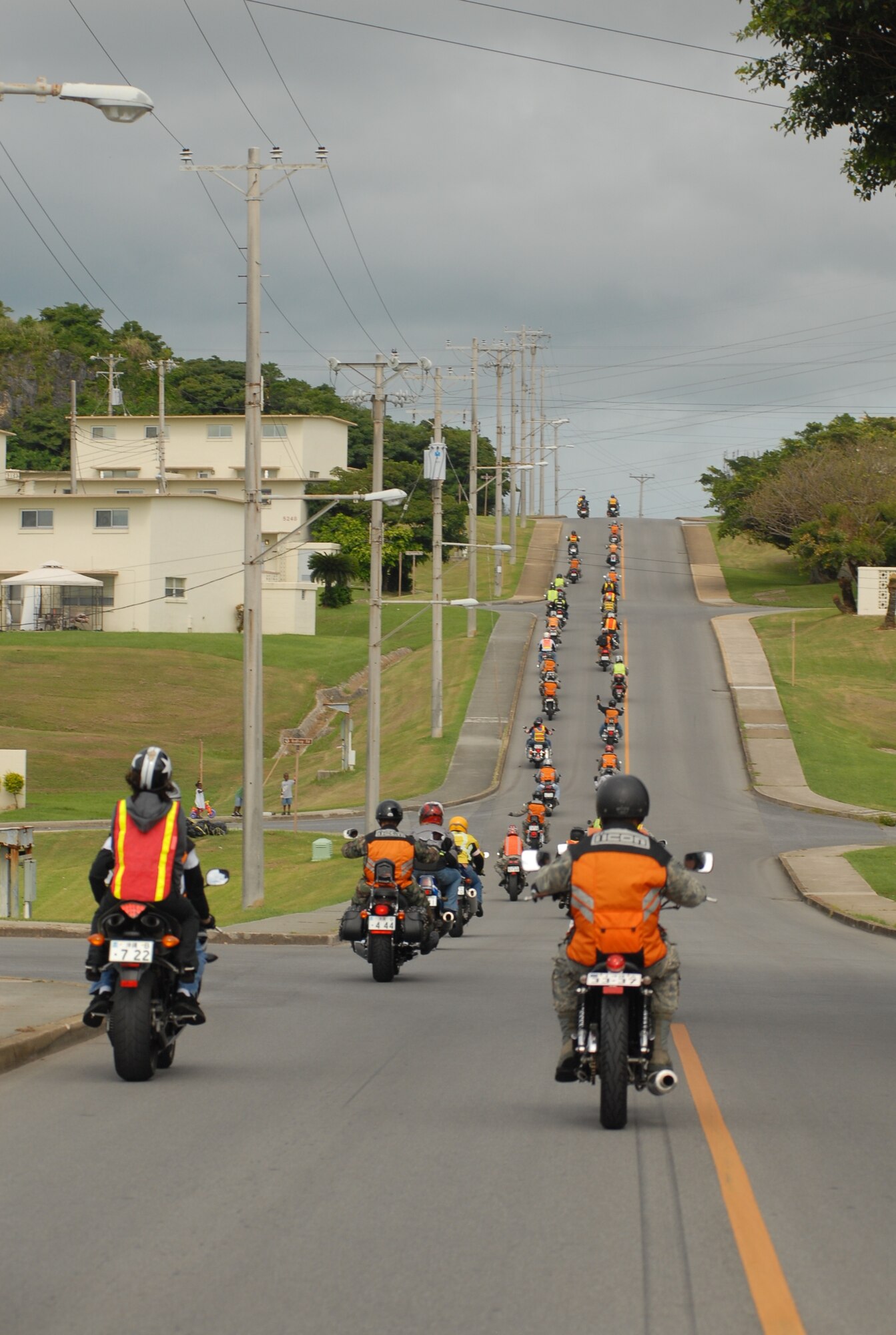 Military members and dependents participate in a safety awareness ride July 25 as part of Motorcycle Safety Week. About 80 riders took part in the ride following a motorcycle rider all-call which emphasized rider safety. (U.S. Air Force photo/Tech. Sgt. Rey Ramon)