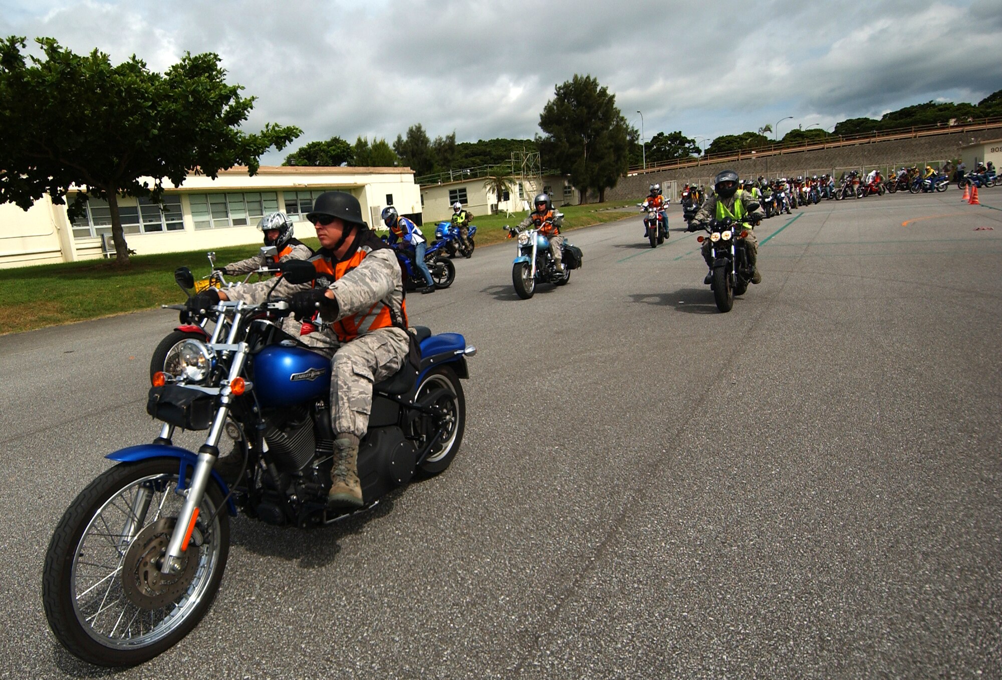 Military members and dependents participate in a safety awareness ride July 25 as part of Motorcycle Safety Week. About 80 riders took part in the ride following a motorcycle rider all-call which emphasized rider safety. (U.S. Air Force photo/Tech. Sgt. Rey Ramon)
