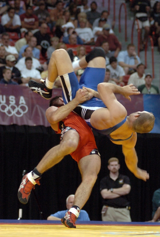 In the final victory of his wrestling career, Staff Sgt. Keith Sieracki throws U.S. Army World Class Athlete Program teammate Sgt. Jess Hargrave during their 74-kilogram Greco-Roman match in the 2008 U.S. Olympic Team Trials for Wrestling June 14, 2008, at the University of Nevada, Las Vegas' Thomas & Mack Center.
