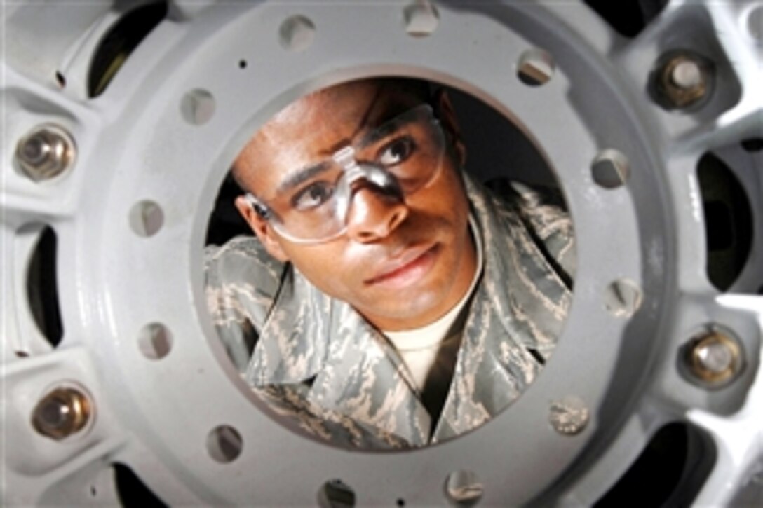 U.S. Air Force Tech. Sgt. Alan L. Scott inspects a KC-135 Stratotanker refueling aircraft brake assembly on March Air Reserve Base, Calif., July 30, 2008. Scott is a pneudraulics technician assigned to the 452nd Maintenance Squadron. 