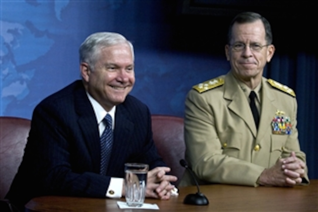 Defense Secretary Robert M. Gates smiles when asked if he is considering staying on with the next administration during a joint press conference with Chairman of the Joint Chiefs of Staff Adm. Mike Mullen at the Pentagon, July 31, 2008. Gates said he is planning on leaving in 173 days, at the end of the current administration. 