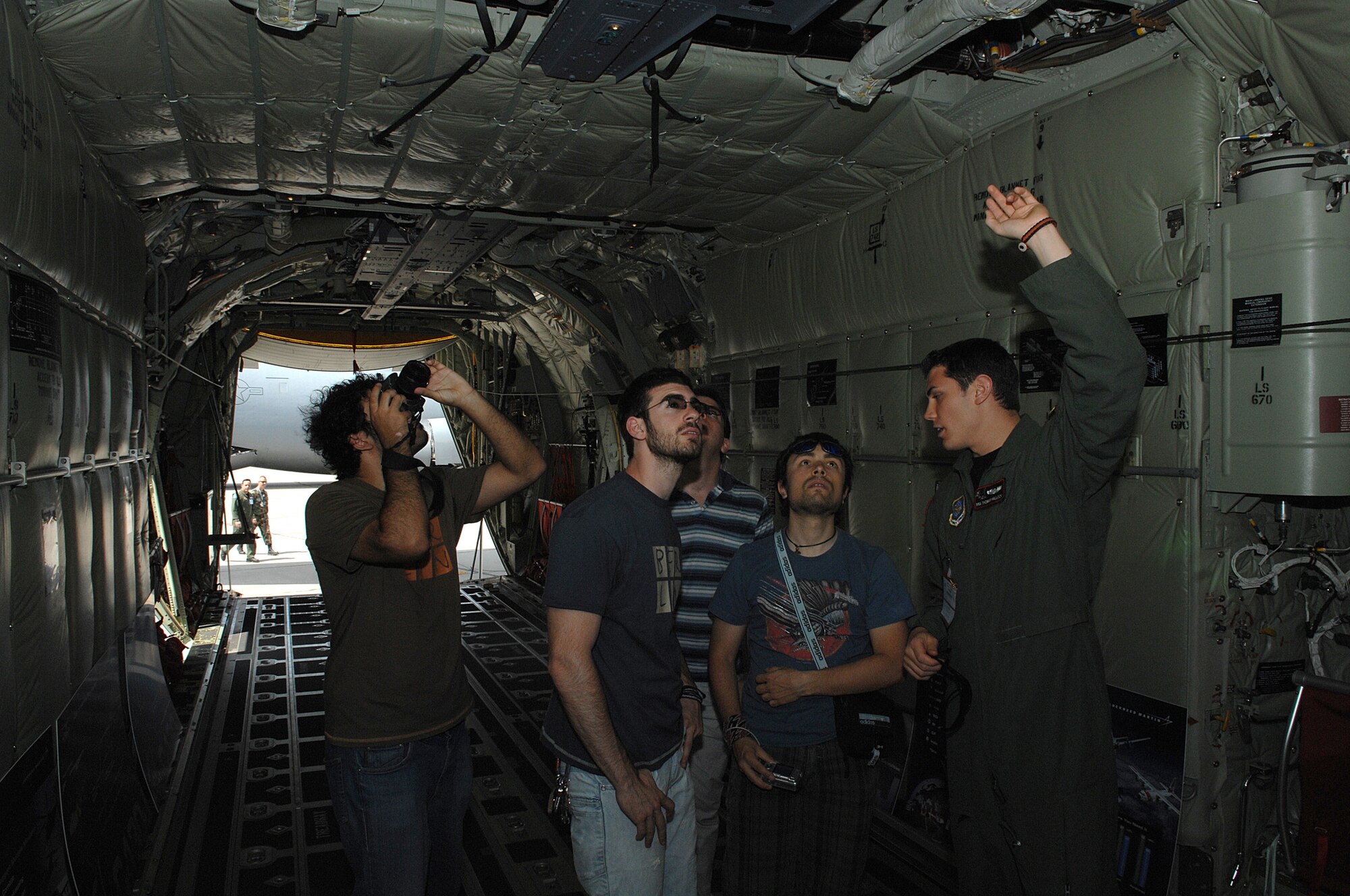 BERLIN, Germany - Senior Airman Thomas Hallock, a C-130J loadmaster of the 41st Airlift Squadron from Little Rock Air Force Base, Ark., gives patrons a tour of the C-130J aircraft during the 2008 Berlin Air Show, Jun. 1.  U.S. participation in the Berlin Air Show enhances the U.S.-German military-to-military relationship, supports our security cooperation strategic direction efforts, and fosters good relations and better understanding among nations. (U.S. Air Force photo by Senior Airman Thomas Hallock) (released)