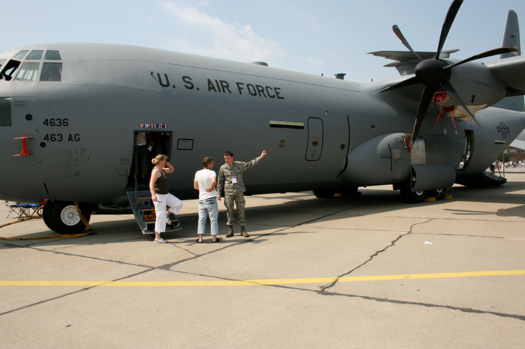 Airman First Class Matthew Coyle shows off a C-130J at the Berlin Air Show in Germany, June 1 2008. The show offers the U.S. an opportunity to showcase capabilities while building relationships with international militaries. (U.S. Air Force photo/Capt Darrick Lee) (released)