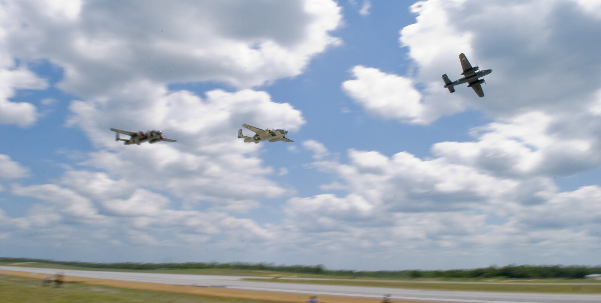 Three B-25 Mitchell bombers, the "Special Delivery," the "Killer B" and the "Yellow Rose," perform a high-speed pass over Duke Field in honor of the Doolittle Raiders who have departed in years past.  The aircraft were participating in the Doolittle Raiders Training Reenactment on Eglin Air Force Base, Fla, May 31, 2008. (U.S. Air Force photo/Lance Cheung)