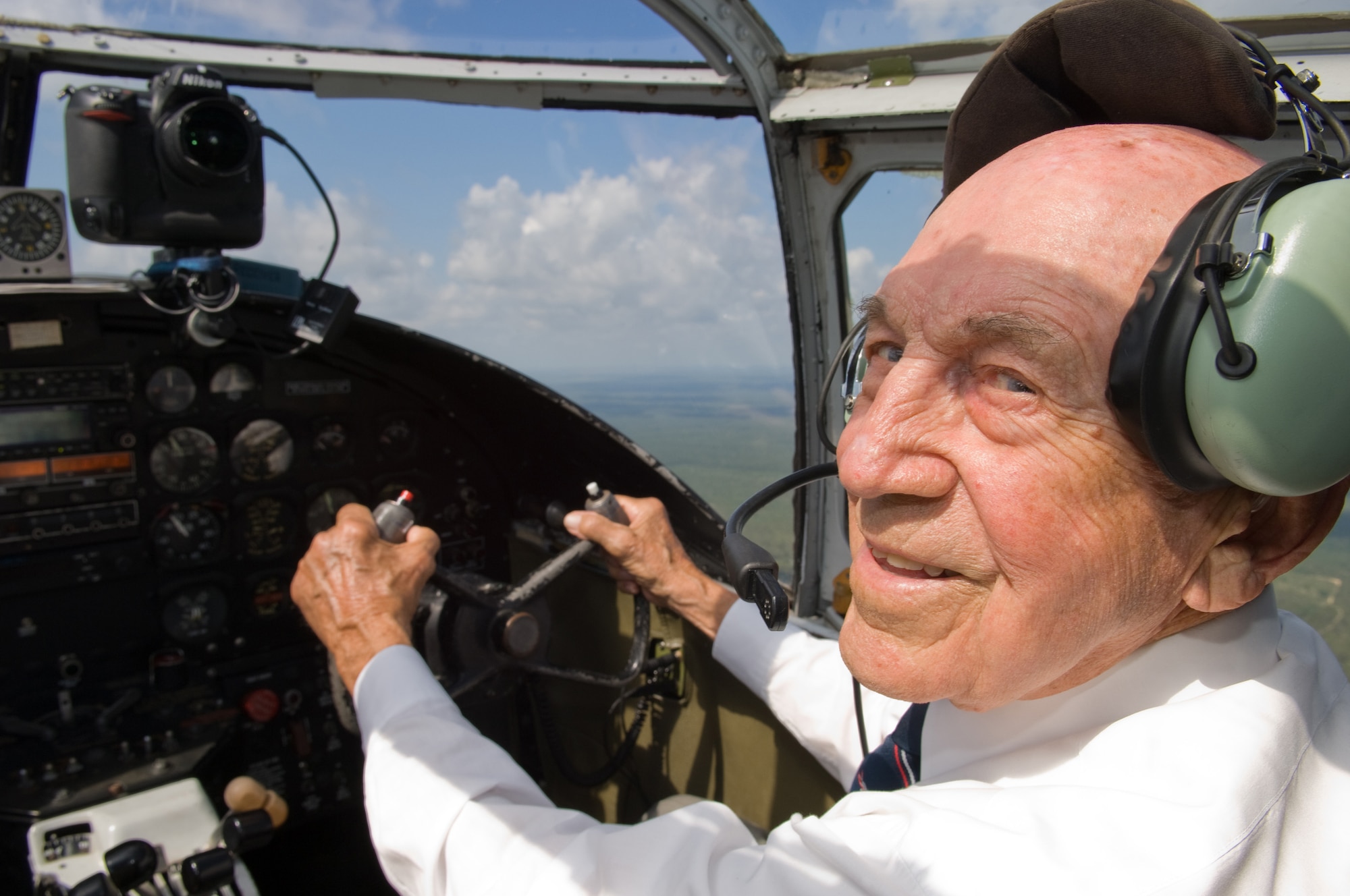 Retired Lt. Col. Robert E. Cole, a B-25 co-pilot and survivor of the Doolittle Raid on Tokyo, happily piloted a holding pattern over Eglin Air Force Base prior to the Doolittle Raiders Training Reenactment at Duke Field on on May 31, 2008.  (U.S. Air Force photo/Lance Cheung)