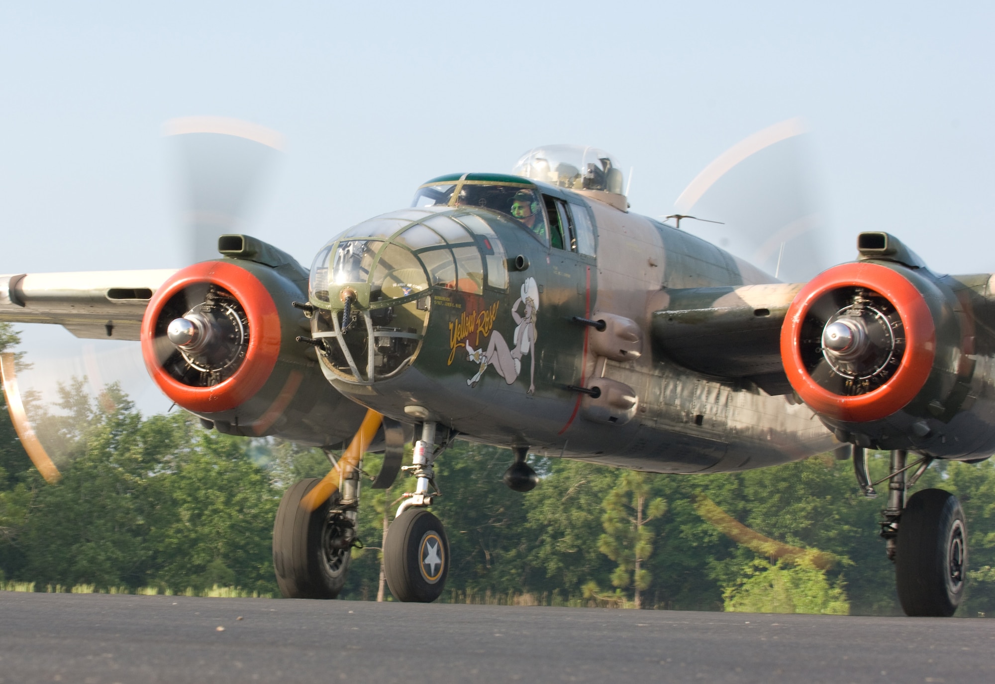 The "Yellow Rose," a B-25 Mitchell bomber prepares to take off from Bob Sikes Airport in Crestview, Fla., May 31. The historic aircraft participated in the Doolittle Raiders Training Reenactment at Duke Field on Eglin Air Force Base.  The "Yellow Rose" is based at San Marcos, Texas. (U.S. Air Force photo/Lance Cheung)