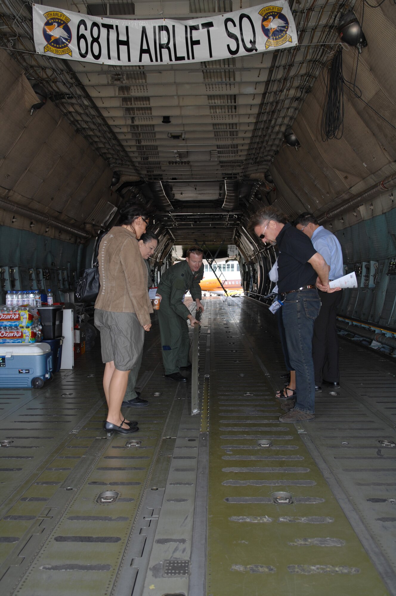 BERLIN, Germany - Capt. Brad Lauderdale, a reserve C-5 Galaxy pilot from the 68th Airlift Squadron of the 433rd Alamo Wing in San Antonio T.X., shows spectators how cargo is loaded on a C-5 during the 2008 Berlin Air Show.  U.S. participation in the Berlin Air Show enhances the U.S.-German military-to-military relationship, supports our security cooperation strategic direction efforts, and fosters good relations and better understanding among nations. (U.S. Air Force photo by Tech. Sgt. Corey Clements) (released)