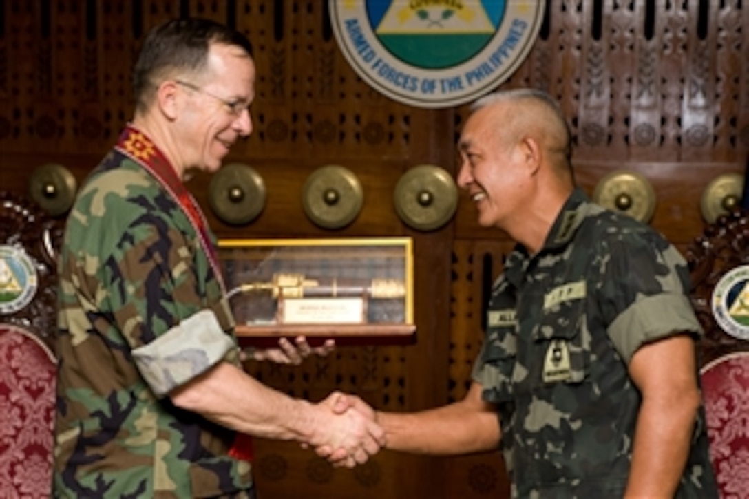 U.S. Navy Adm. Mike Mullen, left, chairman of the Joint Chiefs of Staff, thanks Philippine Lt. Gen. Nelson Allaga, commander the Phillipines' Western Mindanao Command, at the conclusion of  a meeting between the military leaders in Zamboanga, Republic of the Philippines, June 1, 2008.  Mullen is on a eight day tour visiting Asian Pacific nations, their leaders and service members assigned to the region.