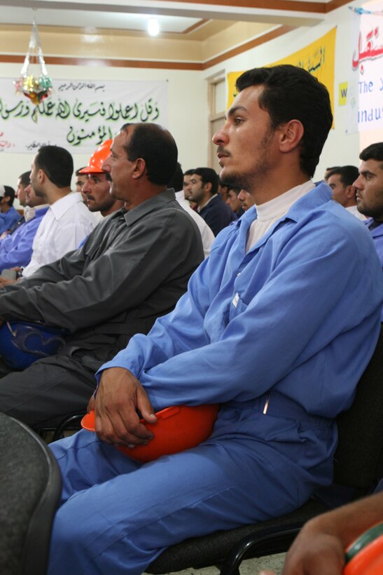 Students listen to several speeches from teachers, public officials of Husaybah, Iraq, and the battalion commander of Task Force 2nd Battalion, 2nd Marines, Regimental Combat Team 5, during a graduation ceremony in Husaybah June 1.  Students learned a variety of skills from welding to computer skills that will not help improve their lives, but the lives of everyone in the region.