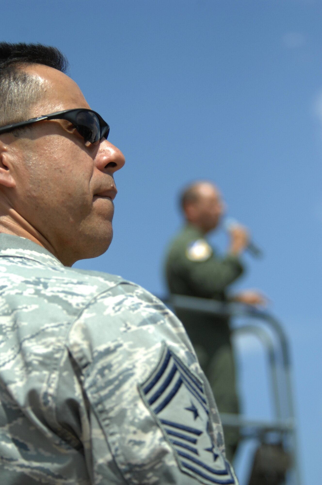 Cheif Master Sgt. Jeffrey Cui, 49th Fighter Wing Command Chief looks at the first F-22 to arrive on Holloman as Col. Jeff Harrigian, 49th Fighter Wing commander speaks about the 7th Fighter Squadron and the features of the F-22A Raptor on Holloman Air Force Base, N.M., June 2..The jet is one of the first two Holloman-tailed F-22s to arrive on base. Prior to landing, the jets flew over the Tularosa Basin, the community had the chance to witness the future of Holloman Air Force Base.

(U.S. Air Force photo/Senior Airman Anthony Nelson Jr)
