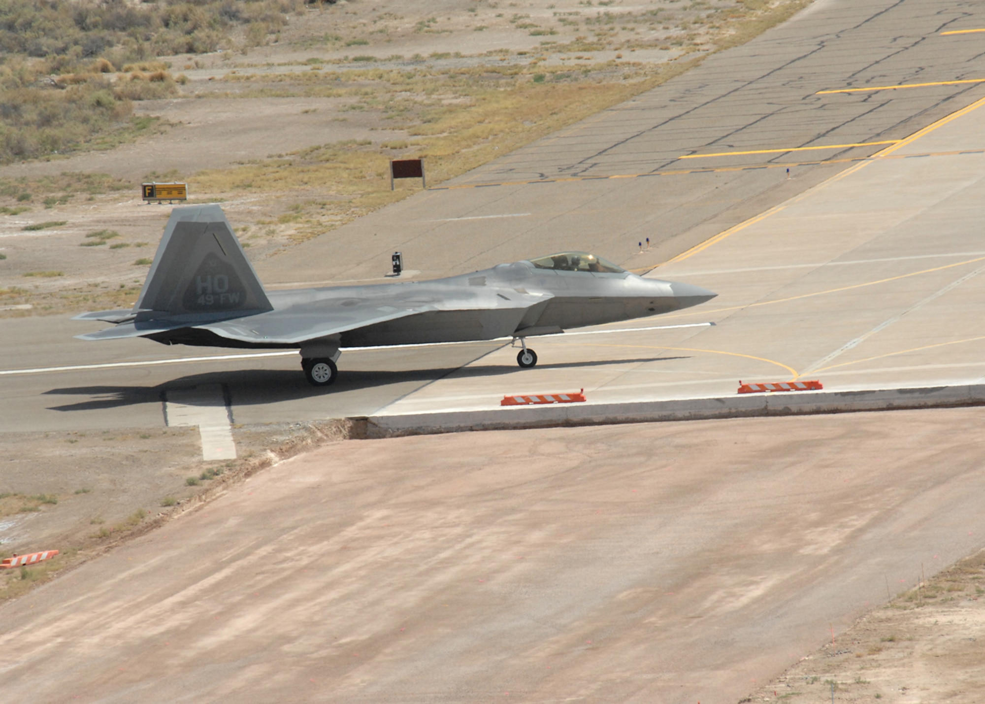 One of two F-22A Raptors taxi into Holloman Air Force Base, N.M., June 2. The jets are the first two Holloman-tailed F-22s to arrive on base. Prior to landing, the jets flew over the Tularosa Basin, allowing the local community a chance to witness the future of Holloman. (U.S. Air Force photo/Senior Airman Tiffany Trojca)
