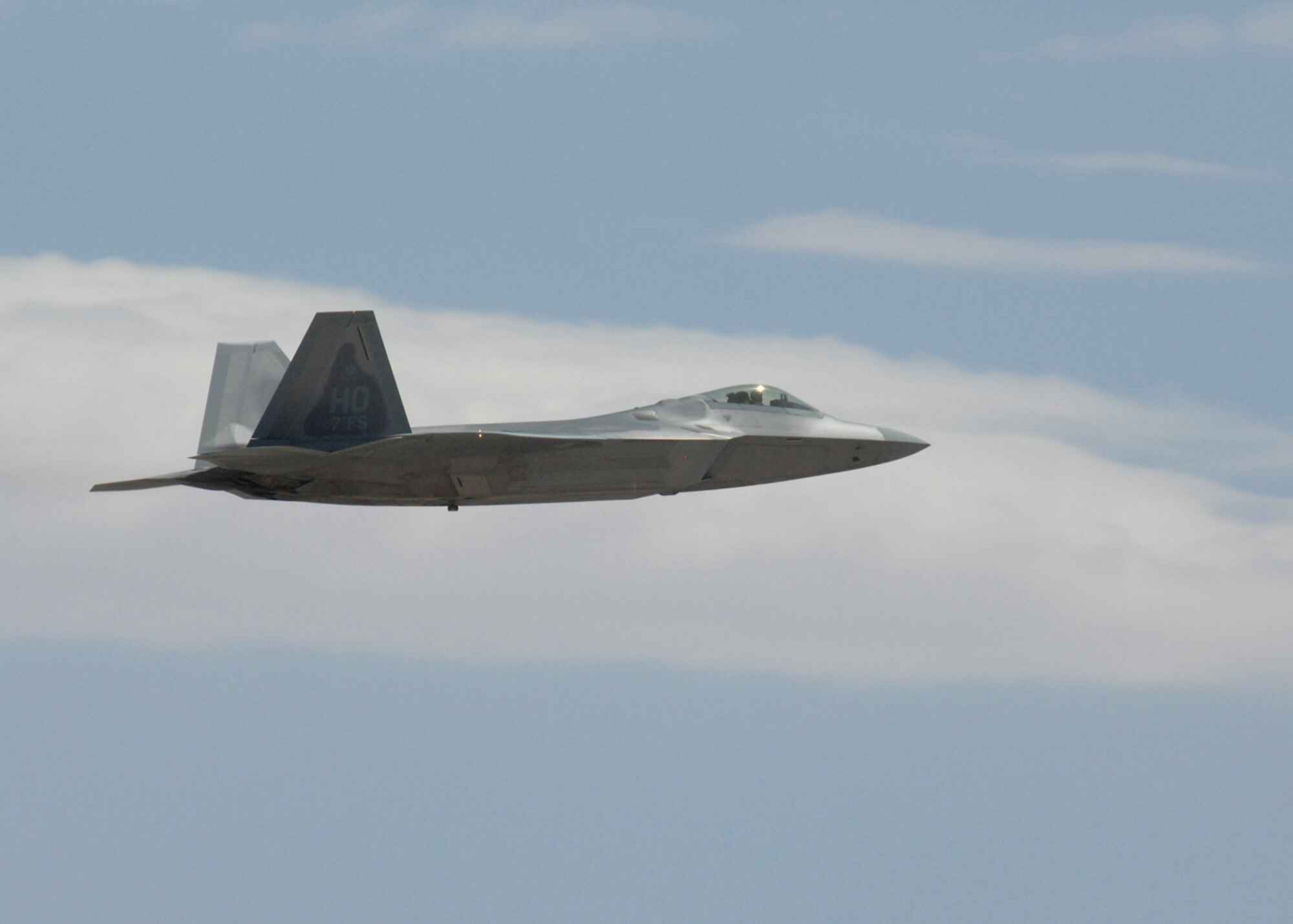 One of two F-22A Raptors fly over Holloman Air Force Base, N.M., June 2. The jets are the first two Holloman-tailed F-22s to arrive on base. Prior to landing, the jets flew over the Tularosa Basin, allowing the local community a chance to witness the future of Holloman. (U.S. Air Force photo/Senior Airman Tiffany Trojca)