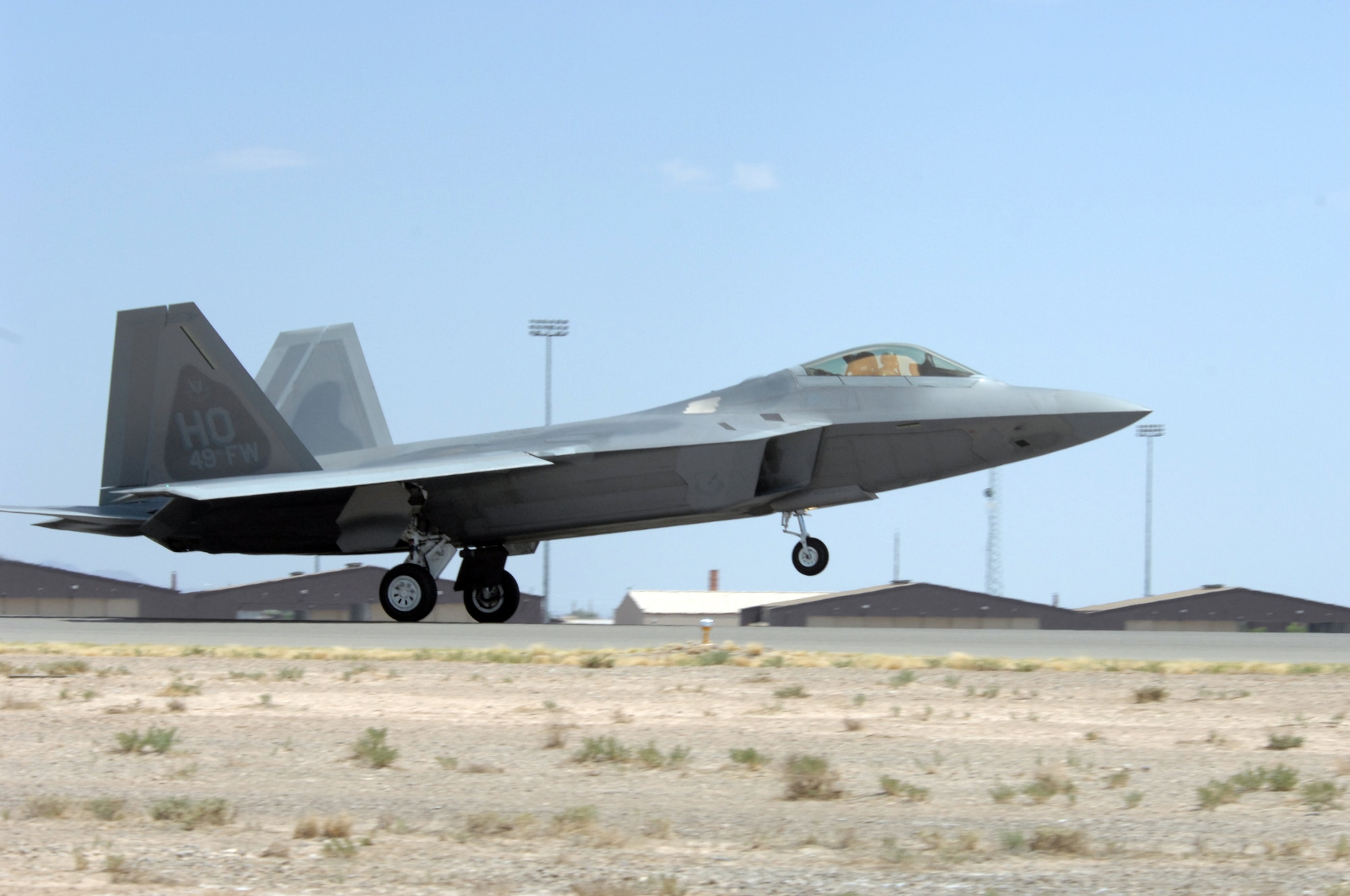An F-22 Raptor flown by Col. Jeff Harrigian, 49th Fighter Wing commander, arrives on Holloman Air Force Base, N.M., June 2.This is one of the first F-22s assigned to Holloman. Prior to landing, the jets flew over the Tularosa Basin, the community had the chance to witness the future of Holloman Air Force Base.

(U.S. Air Force photo/Senior Airman Anthony Nelson Jr)
