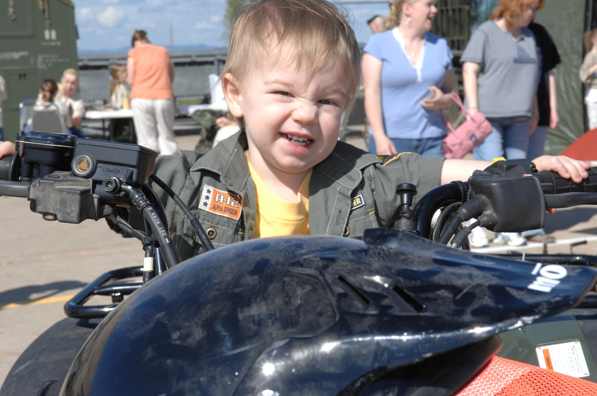 Matthew Klein, son of 1st Lt.Terry Klein, 28th Medical Group bioenvironmental engineer, simulates driving an all terrain vehicle during the kid’s deployment line here, May 31. The line is held to give children of deploying or deployed parents a glimpse of what their parents undergo. (U.S. Air Force photo/Airman 1st Class Adam Grant)