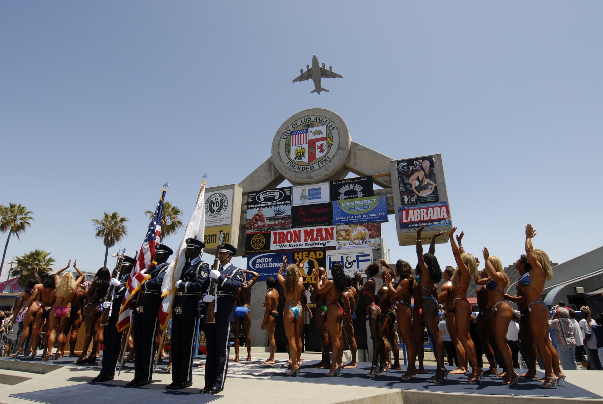 A C-17 from March ARB flies over the Venice Beach's Muscle Beach International Classic on Memorial Day.  More than 3,000 people came out for the annual bodybuilding competition and salute to the Armed Forces.  An Air Force honor guard opened the event. (Photo by Lou Hernandez) 