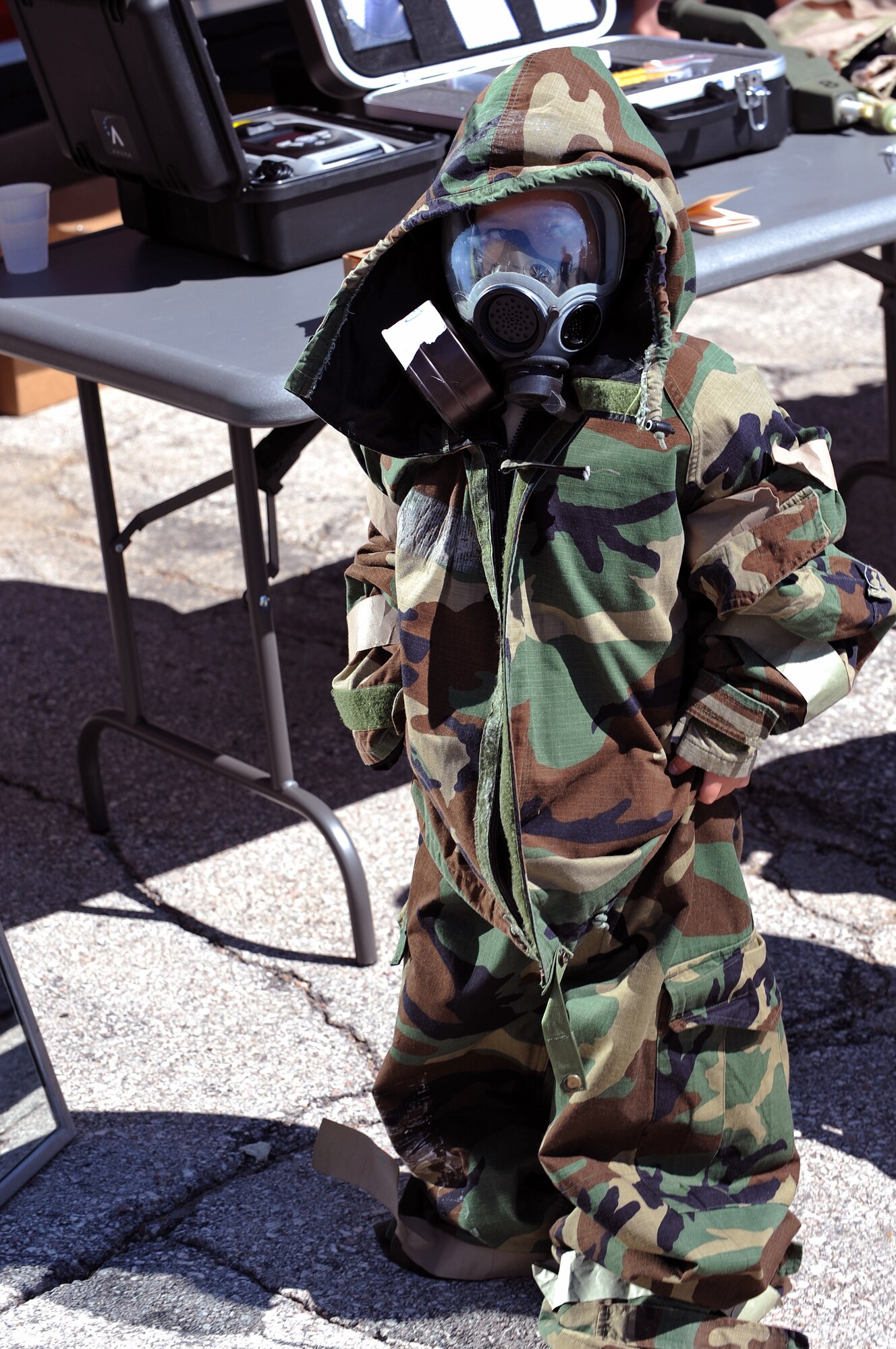 David Wilson, son of Tech. Sgt. Steven Wilson, South Dakota Air and Space Museum director, wears mission-oriented protective posture gear during Operation Awareness 2008 here, May 31. The operation gave children the chance to see how their parents get ready for deployment. (U.S. Air Force photo/Senior Airman Marc I. Lane)