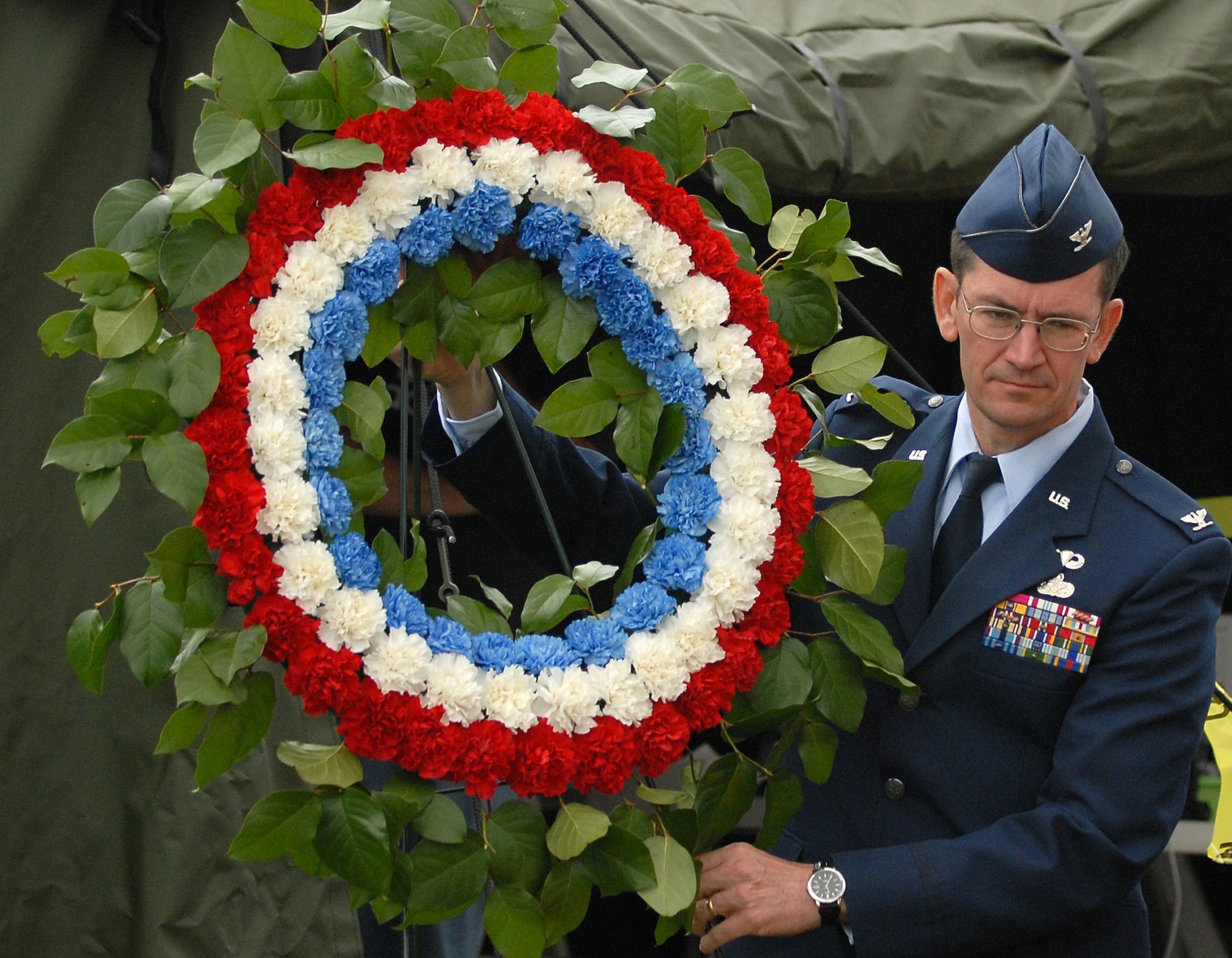 61st Air Base Wing Commander Col. Joseph Schwarz lays a wreath in remembrance of military dead at the annual Memorial Day observance at Green Hills Memorial Park in Rolling Hills, May 26. (Photo by Stephen Schester)