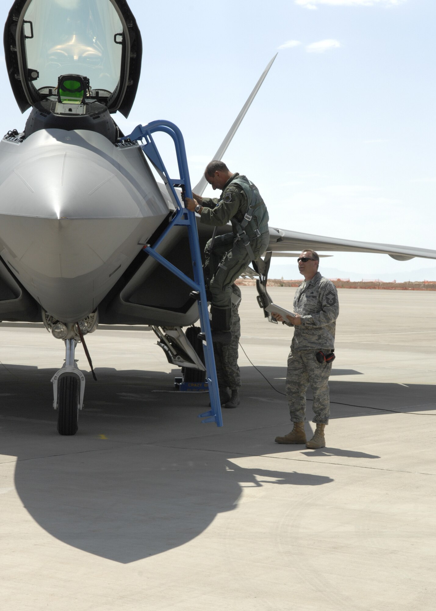 Col. Jeff Harrigian, 49th Fighter Wing commander, steps out of an F-22 Raptor on Holloman Air Force Base, N.M., June 2.This is one of the first F-22s assigned to Holloman. (U.S. Air Force photo/Airman 1st Class Rachel A. Kocin)