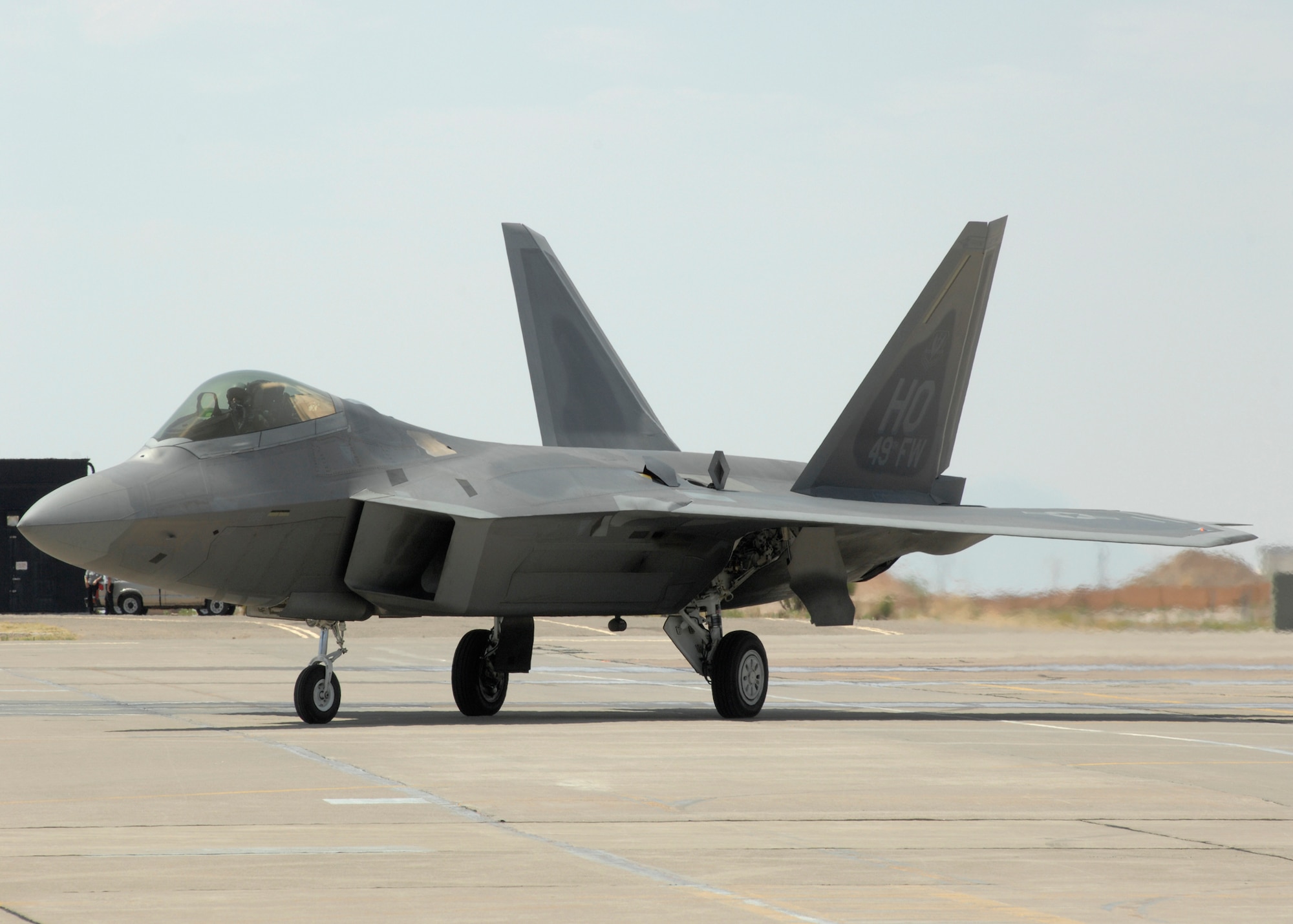An F-22 Raptor flown by Col. Jeff Harrigian, 49th Fighter Wing commander, arrives on Holloman Air Force Base, N.M., June 2.This is one of the first F-22s assigned to Holloman. (U.S. Air Force photo/Airman 1st Class Rachel A. Kocin)