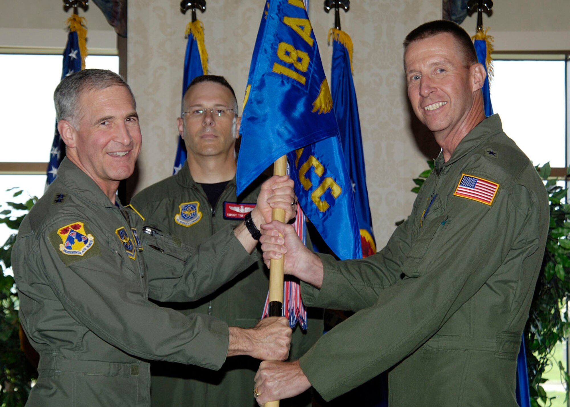 Brigadier General Mark S. Solo (right) assumes command of the Tanker Airlift Control Center (TACC) from Major General James A. Hawkins, 18th Air Force commander, during the change of command ceremony at the Scott Club on June 2. General Solo is replacing Major General Ronald R. Ladnier as the commander of the TACC. (U.S. Air Force photo by Senior Airman Jonathan Lovelady