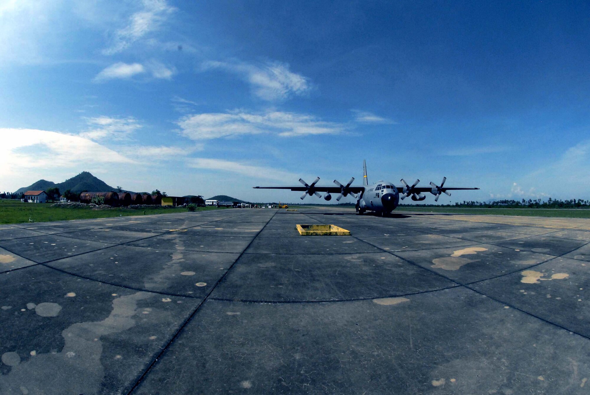 A C-130 Hercules taxies down the runway May 24 after landing at Kampong Chhnang Province Airfield, Cambodia. This mission delivered 3,000 pounds of medical supplies for two separate operating locations in Cambodia in support of Operation Pacific Angel, a joint/combined humanitarian assistance operation in support of capacity-building efforts. Participating services include the active duty, Reserve and National Guard components of the Air Force, Army, Royal Thai air force, and Royal Cambodian armed forces. The C-130 is from the 144th Airlift Squadron from Kulis Air National Guard Base, Alaska. (U.S. Air Force photo/Tech. Sgt. Tom Czerwinski) 
