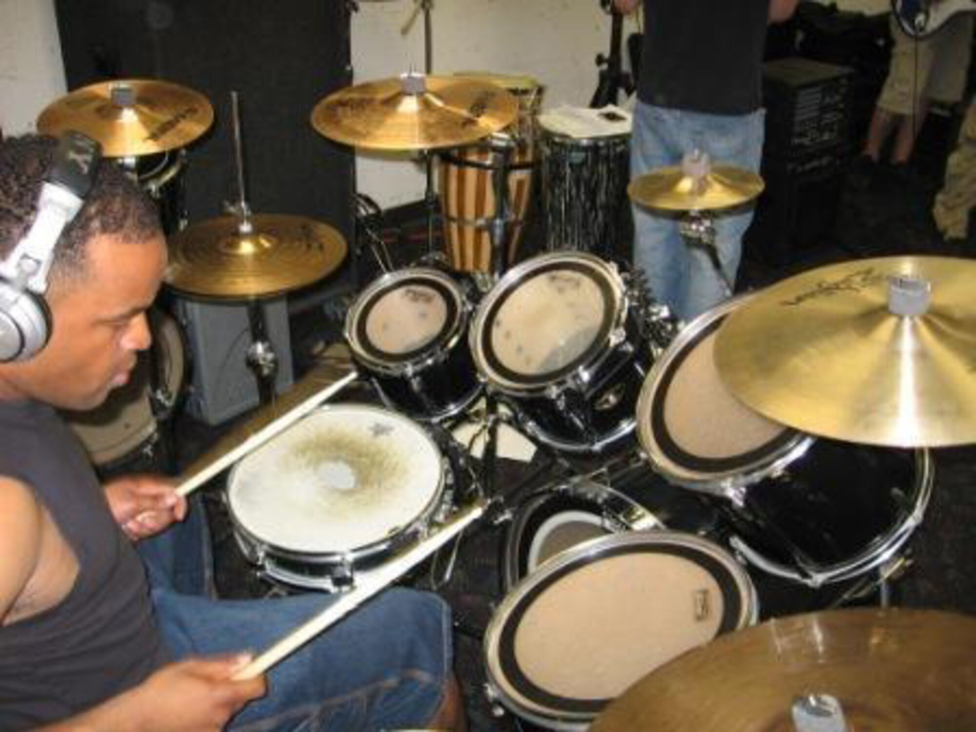 CANNON AIR FORCE BASE, N.M. - Tech. Sgt. Dan Lee practices on the drums during a jam session with Stay the Stranger. Stay the Stranger consists entirely of active-duty Airmen who met while stationed here. (courtesy photo)