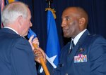 Brig. Gen. Alfred J. Stewart, right, accepts the Air Force Recruiting Service guidon and AFRS command from Gen. William R. Looney III, Air Education and Training Command commander, during a change of command ceremony June 2 on Randolph Air Force Base, Texas. As AFRS commander, General Stewart is responsible for accessing qualified men and women to meet the personnel procurement requirements of the Air Force. (U.S. Air Force photo/Rich McFadden)