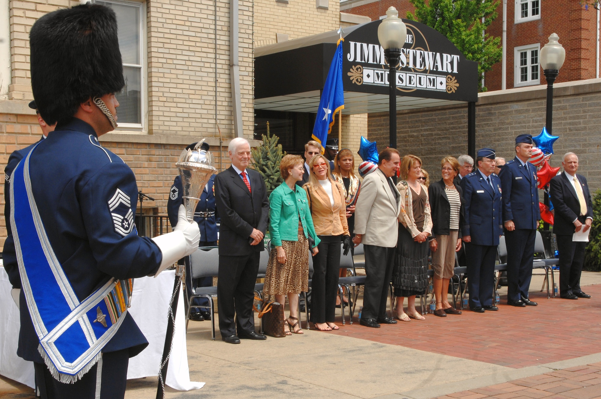 The Jimmy Stewart Centenniel Celebration took place May 24 in his hometown of Indiana, Pa. Nick and Nina Clooney (from left to right), parents of actor George Clooney; Marie and Rich Little, comedian; Kelly Stewart Harcour and Judy Stewart, daughters of Jimmy Stewart; Maj. Gen. Charles E. Stenner Jr., assistant deputy chief of staff for strategic plans and programs for Headquarters Air Force; Col. Terry Ross, 11th Wing vice commander; and Carson Greene, president of the Jimmy Stewart Museum; observe the U.S. Air Force Band's Ceremonial Brass unit perform. (U.S. Air Force photo/Senior Airman Timothy Chacon) 
