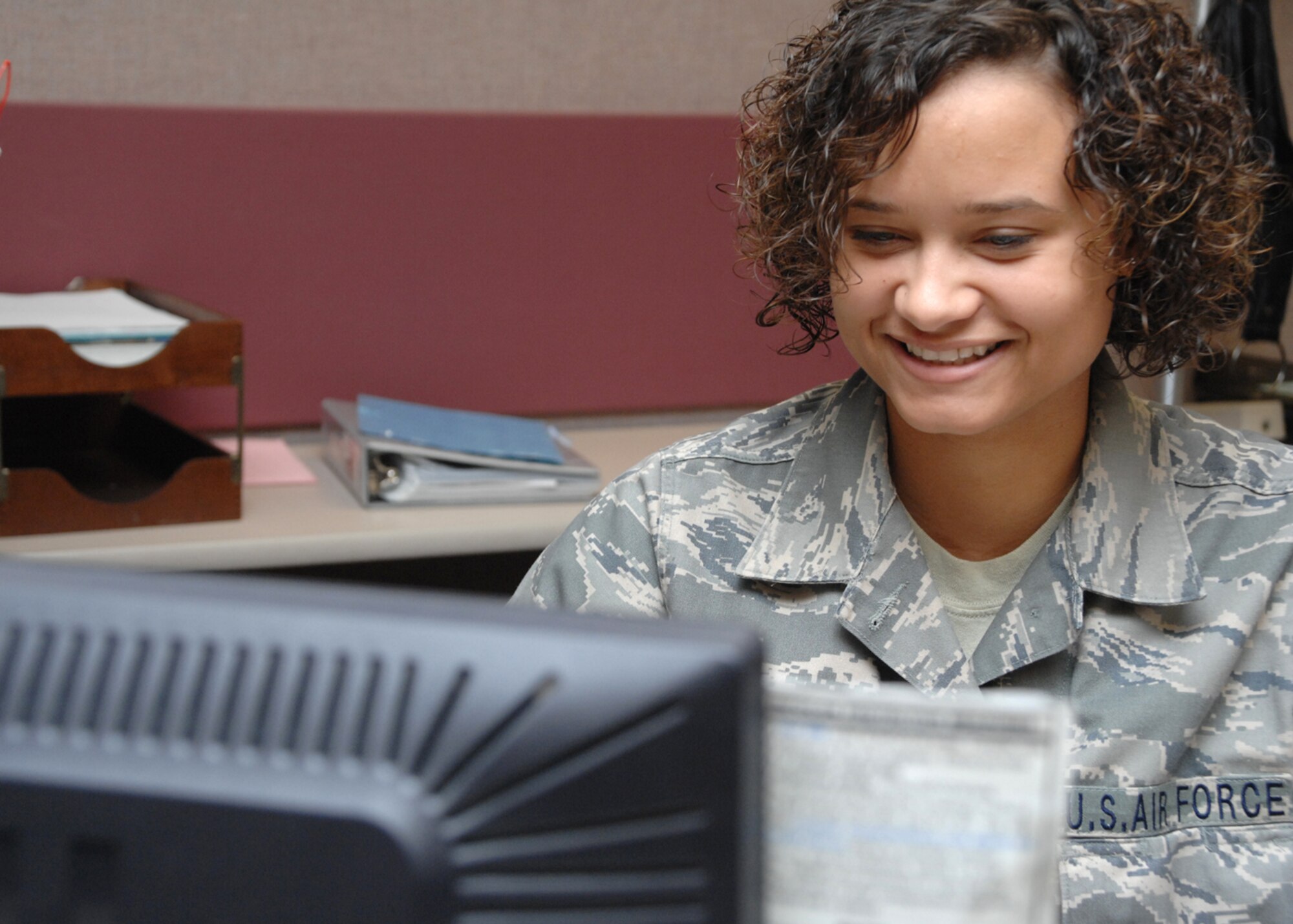 Airman 1st Class Catherine Gates, 49th Mission Support Group, reviews outbound assignments at Holloman Air Force Base, N.M., on May 30. Airman Gates is an outbound assignments counselor for the is responsible for outbound assignments.(U.S. Air Force photo/Senior Airman Tiffany Trojca)