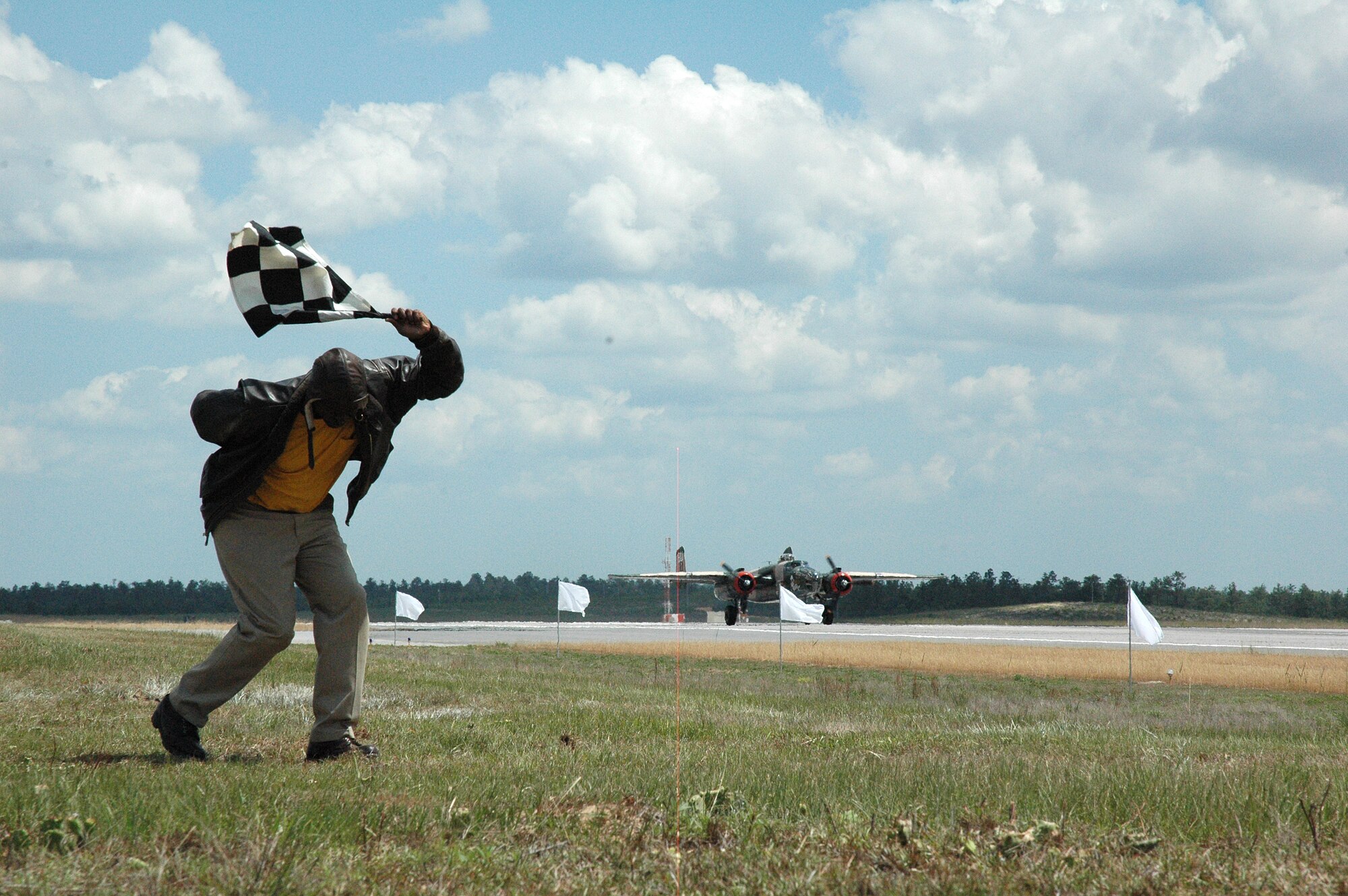 EGLIN AIR FORCE BASE, Fla. -- Two of the three B-25 Mitchells which participated in the Doolittle Reunion event at Duke Field May 31 were given the green light for take off by an airfield technician. The site, also known as Field 3, is one of the two locations the Doolittle Raiders trained for their now historic mission to bomb key strategic locations in Japan in 1942 during World War II in response to the bombing of Pearl Harbor, Hawaii. 