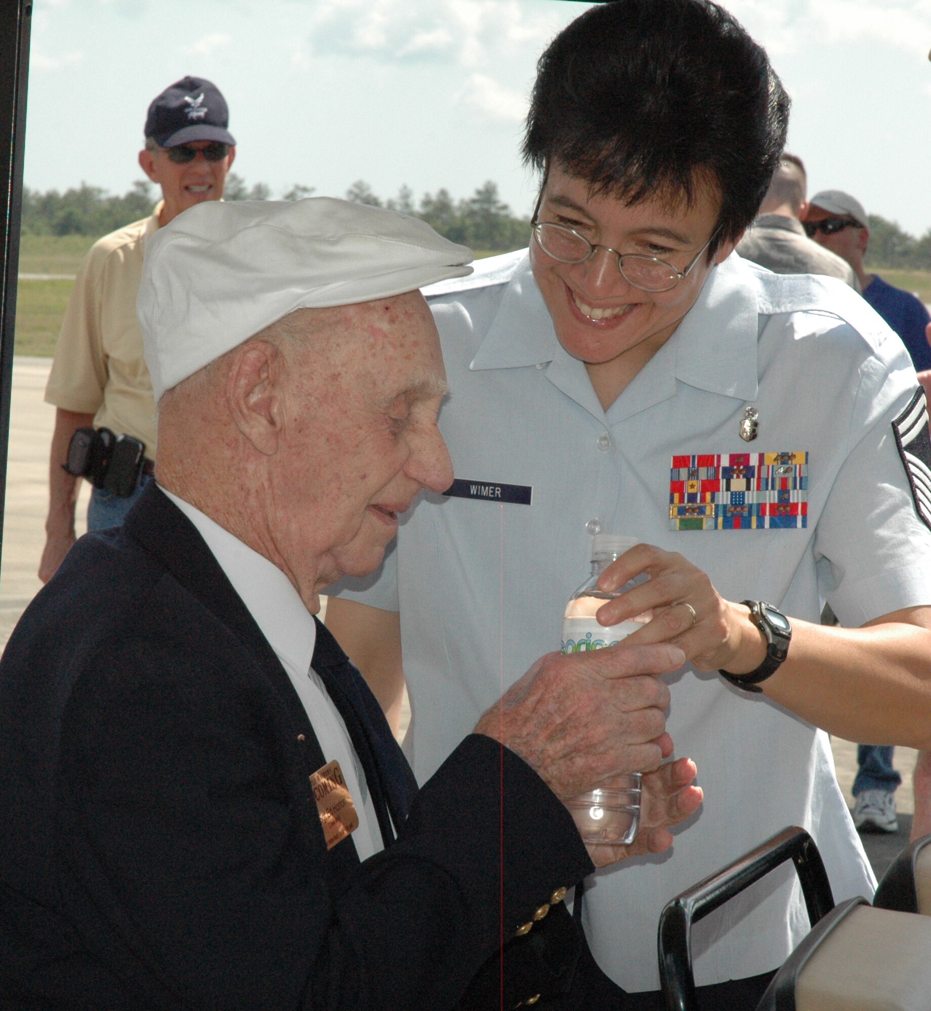 EGLIN AIR FORCE BASE, Fla. -- Senior Master Sgt. Rhonda Wimer, 96th Medical Operations Squadron, helped retired Master Sgt. Ed Horton, Doolittle Raider from Crew 10, throughout the homecoming events. Sergeant Horton arrived at the May 31 ceremony at Duke Field in the B-25 Mitchell nicknamed the Special Delivery. (U.S. Air Force photo/Staff Sgt. Stacia Zachary)