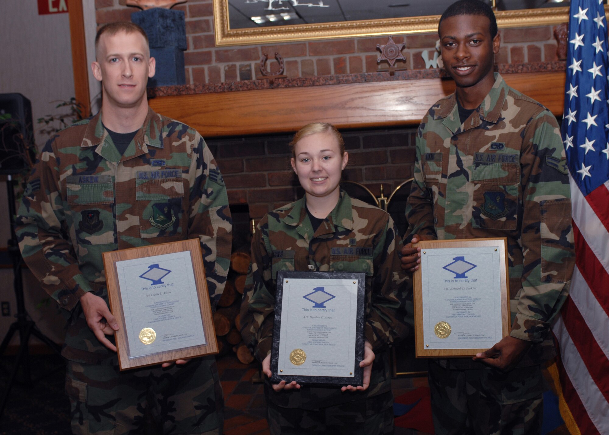 CANNON AIR FORCE BASE, N.M. - (left to right) Senior Airman Curtis Askew, 27 Special Operations Maintenance Operations Squadron, Airman 1st Class Heather Acres, 27 Special Operations Medical Dental Operations Squadron, and Airman 1st Class Kenneth Perkins, 27 Special Operations Component Maintenance Squadron receive Diamond Sharp awards at Pecos Trail Dining Facility on May 30.  The Diamond Sharp awards are presented to Cannon's finest Airman, ranging from Airman Basic to Staff Sergeant. (U.S. Air Force photo/Airman 1st Class James R. Bell)