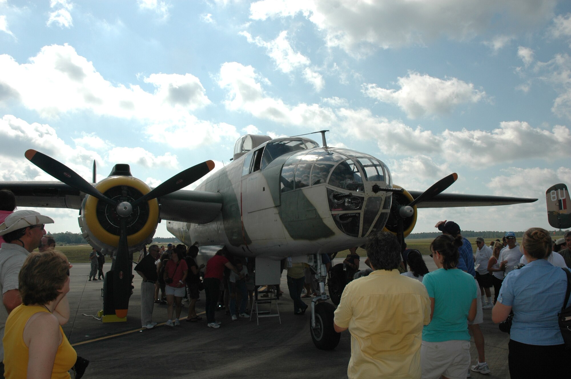Visitors view a static display of the operational "Killer B" B-25 Mitchell aircraft during the Doolittle Raiders Homecoming re-enactment May 31 at Duke Field, Fla. The Doolittle Raid, planned by Lt. Col. James "Jimmy" Doolittle, was the first air raid by the United States to strike Japan in World War II and was carried out in retaliation for Japan's attack on Pearl Harbor Dec. 7, 1941. Sixteen B-5 Mitchells took off from an aircraft carrier, a first for the airframe, and bombed military targets in Japan. All 16 aircraft were lost when crews had to ditch or bail out over China when they ran out of fuel. There are only 11 out of 80 original crewmembers alive today. (U.S. Air Force Photo/Airman 1st Class James P. Brock III)