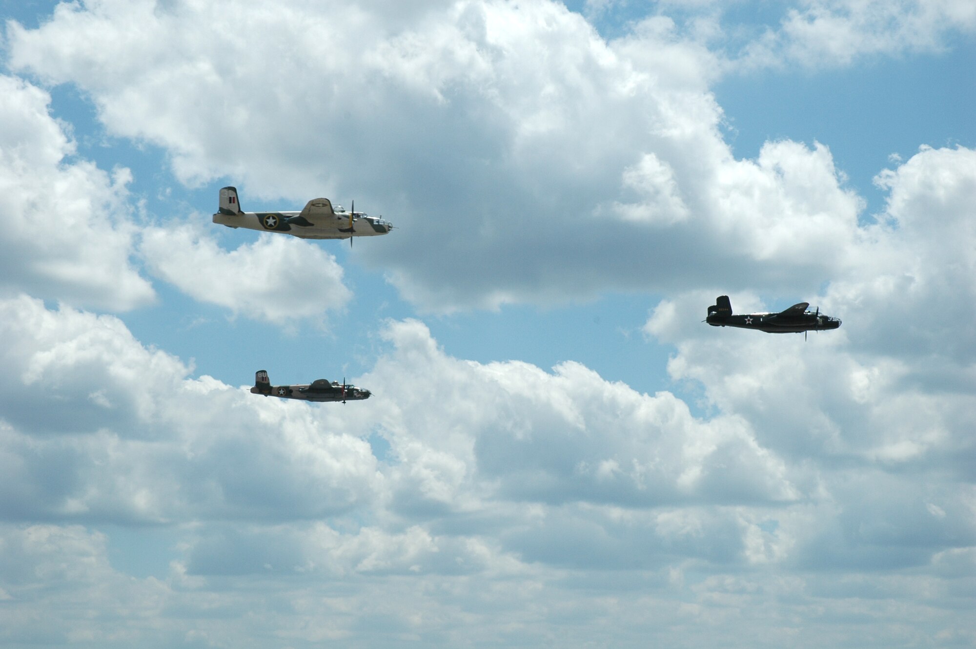 Three B-25 Mitchells fly over Duke Field's flight line during the Doolittle Raiders Homecoming re-enactment May 31. The Doolittle Raid, planned by Lt. Col. James "Jimmy" Doolittle, was the first air raid by the United States to strike Japan in World War II and was carried out in retaliation for Japan's attack on Pearl Harbor Dec. 7, 1941. Sixteen B-5 Mitchells took off from an aircraft carrier, a first for the airframe, and bombed military targets in Japan.  All 16 aircraft were lost when their crews had to ditch or bail out over China when they ran out of fuel. There are only 11 out of 80 original crewmembers alive today. (U.S. Air Force Photo/Airman 1st Class James P. Brock III)