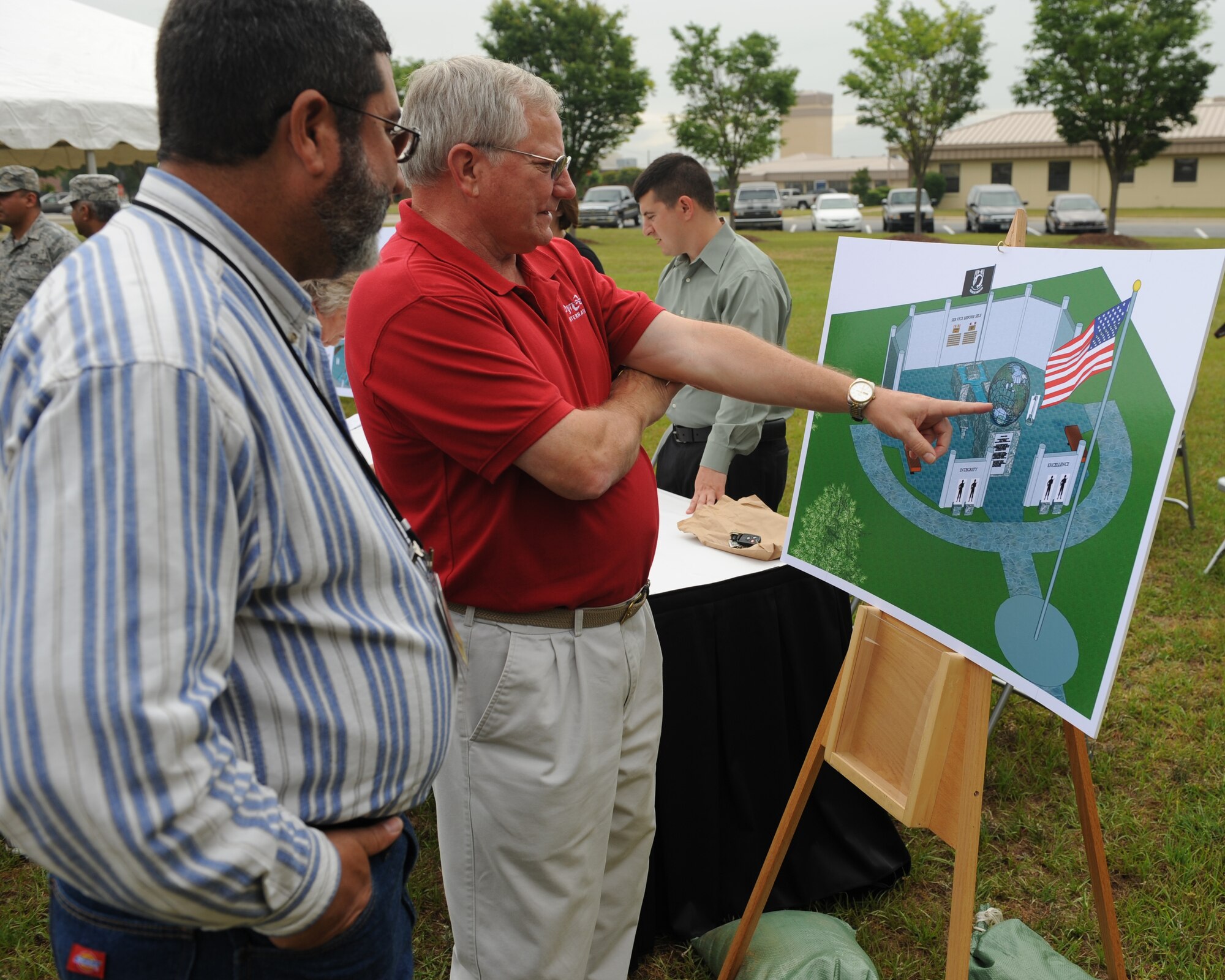 SHAW AIR FORCE BASE, S.C.—Visitors to the 9th Air Force and U.S. Air Forces Central Fallen Airman Memorial ground breaking ceremony view the proposed design of the memorial May 30. The memorial will honor those military members who have fallen or have served or are currently serving since the inception of 9th AF, June 28, 1942. (U.S. Air Force Photo/Staff Sgt. Henry Hoegen) 