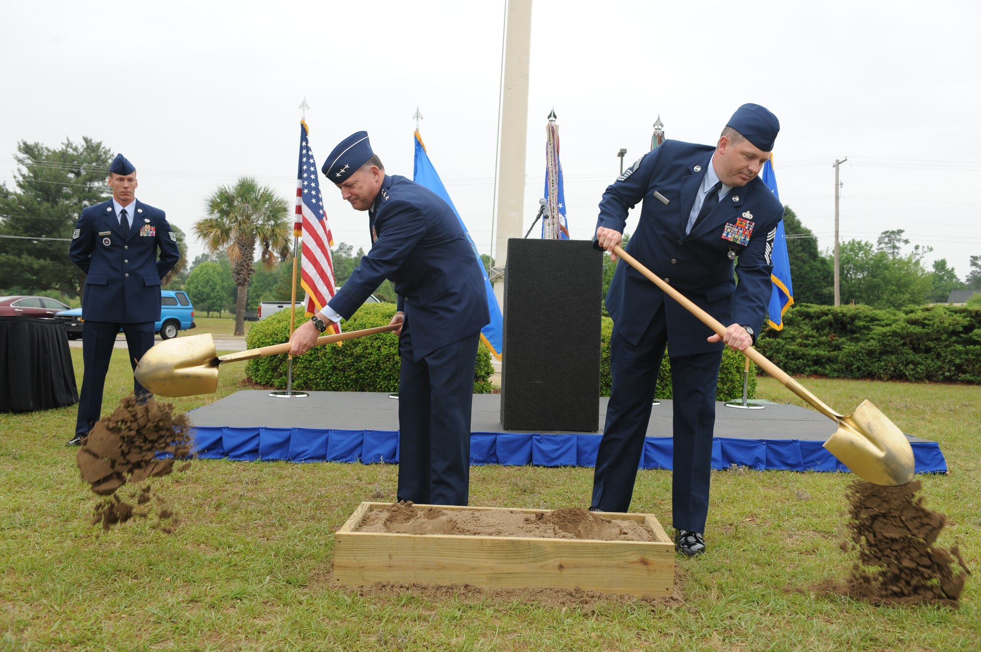SHAW AIR FORCE BASE, S.C.— Lt. Gen. Gary North, 9th Air Force and U.S. Air Forces Central commander, and Chief Master Sgt. Scott Dearduff 9th AF and U.S. AFCENT command chief, make the symbolic first dig of the ground breaking  for 9th AF and U.S. AFCENT Airman’s Memorial May 30. The memorial will honor those military members who have fallen or have served or are currently serving since the inception of 9th AF, June 28, 1942. (U.S. Air Force Photo/Staff Sgt. Henry Hoegen) 