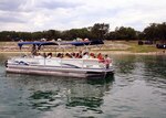 Team Randolph members enjoy a boat ride during Spring Fling May 17 at the Randolph Canyon Lake Recreation Area. The facility offers numerous amenities, including two beaches, three boat ramps, camping, RV parking, a two-mile nature trail, playgrounds, cabins and shelters. For boating and fishing enthusiasts, the park includes a marina with a fishing pier, boat rentals and slips for boat owners. The marina store offers bait, food, beverages, 24-hour gas and rental equipment such as skis, wake boards and tubes. The park also offers the Texas Parks and Wildlife Boaters Safety Course for free, which is required of boat renters at the park marina. (Courtesy photo)
