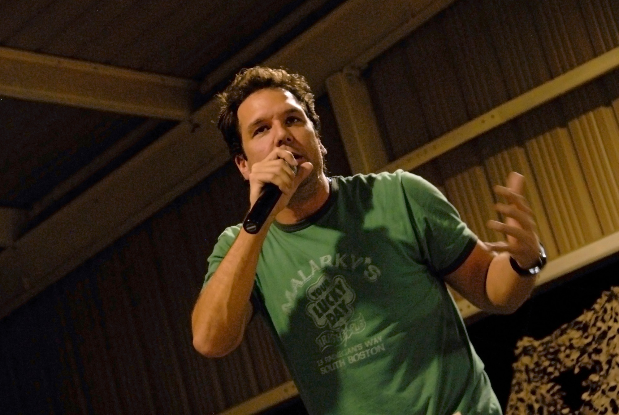 SOUTHWEST ASIA -- Comedian Dane Cook entertains Airmen deployed to the 386th Air Expeditionary Wing during a comedy show May 30, 2008, at an air base in the Persian Gulf Region. Comedians Al Del Bene, Robert Kelly, and Dane Cook are visiting deployed troops throughout the area of responsibility during a five-day United Service Organizations sponsored Combat Comedy Tour. (U.S. Air Force photo/ Staff Sgt. Patrick Dixon)