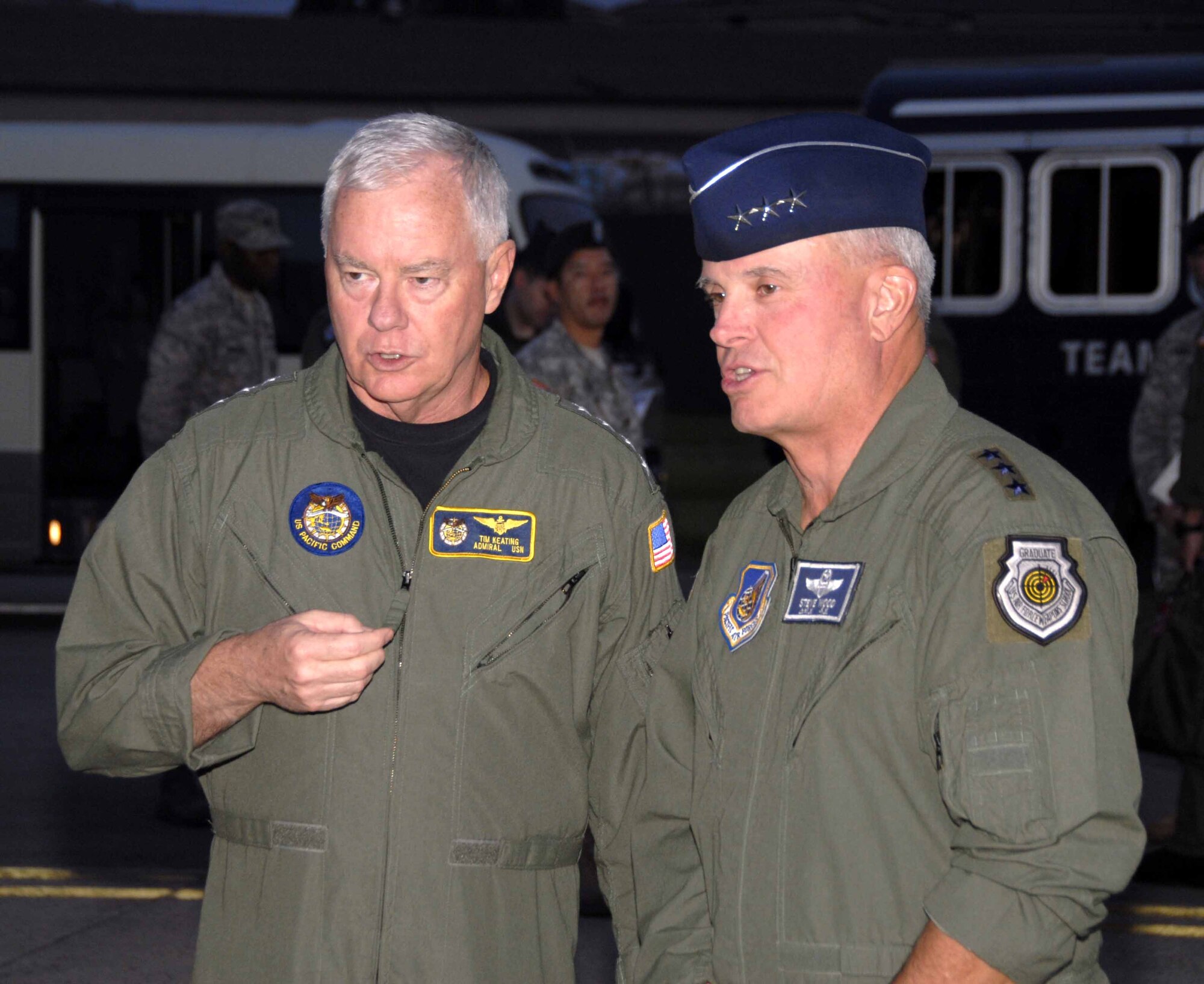 OSAN AIR BASE, Republic of Korea -- Adm. Timothy Keating, commander of U.S. Pacific Command, speaks with Lt. Gen. Stephen Wood, 7th Air Force commander, after the admiral's arrival to Osan June 1. During his visit, Admiral Keating spoke with members of the top three enlisted grades about issues pertaining to quality of life and the mission for Pacific Forces. (U.S. Air Force photo/Senior Airman Christopher Boitz)
