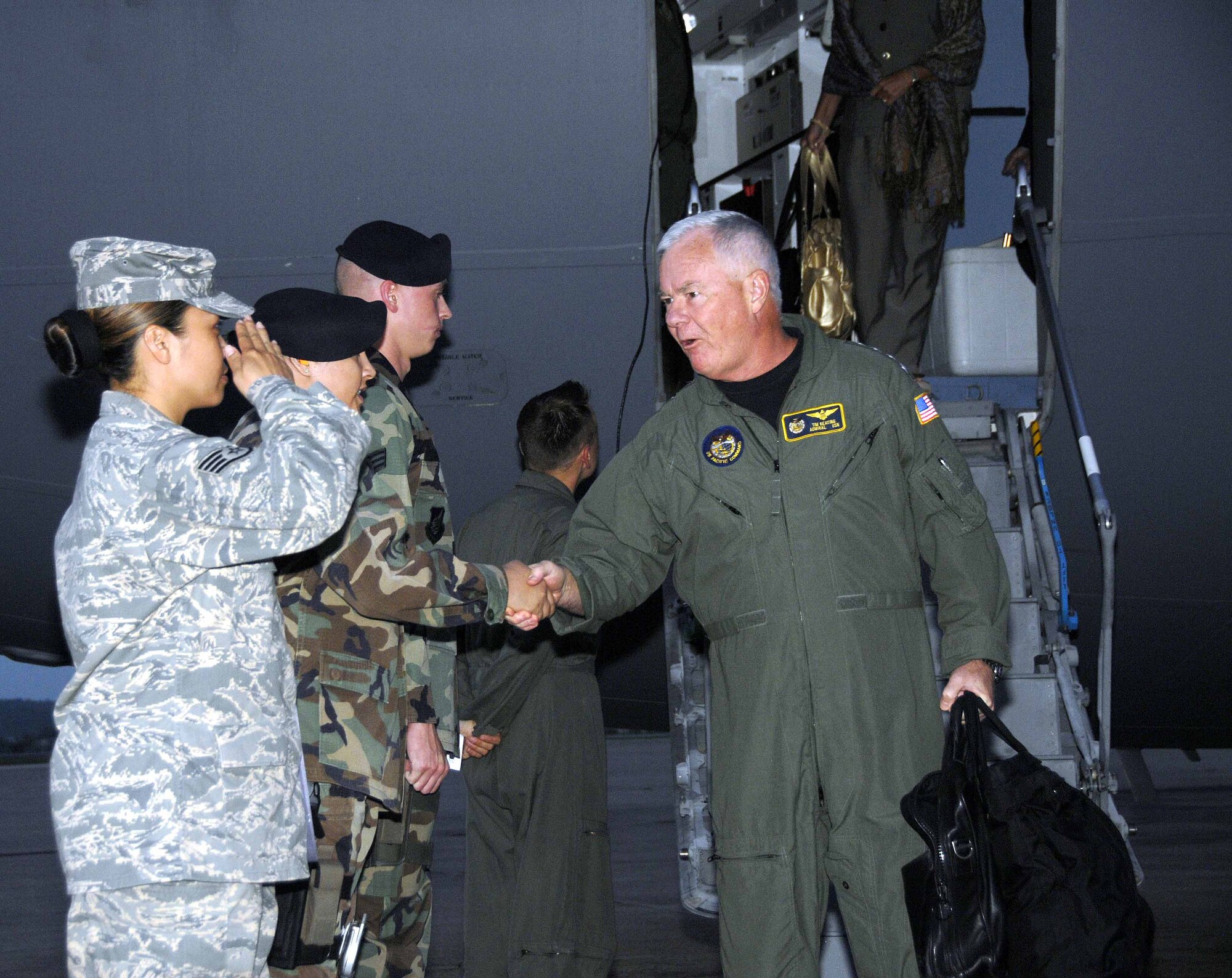 OSAN AIR BASE, Republic of Korea -- Adm. Timothy Keating, commander of U.S. Pacific Command, is greeted by Team Osan members upon his arrival to the base June 1. During his visit, Admiral Keating spoke with members of the top three enlisted grades about issues pertaining to quality of life and the mission for Pacific Forces. (U.S. Air Force photo/Senior Airman Christopher Boitz)