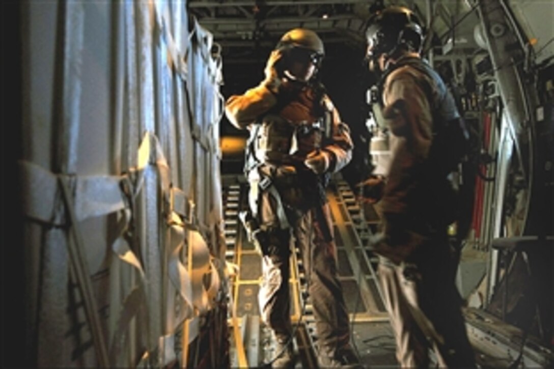 U.S. Air Force load masters from a C-130 release several pallets of water, clothing and toys during an air drop of humanitarian supplies to al-Amarah, Balad, Iraq, May 21, 2008. The supplies were distributed to local citizens by the Iraqi army as they continued to bring security and stability to the region. 