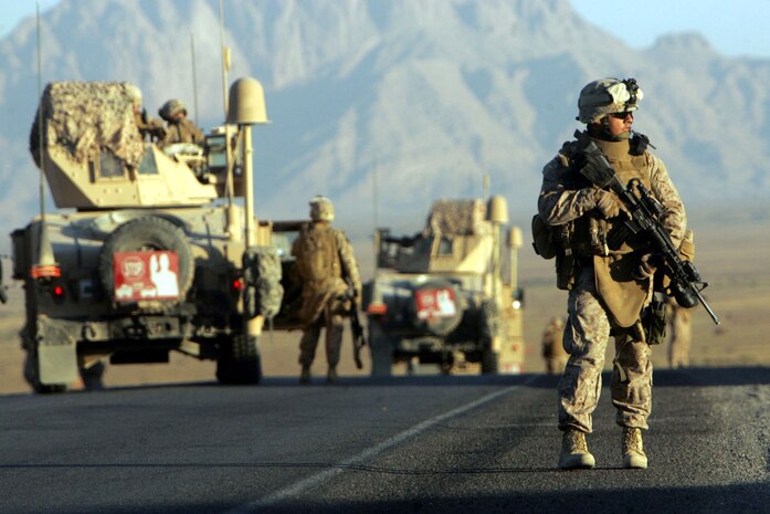 Cpl. Jose Y. Campos, 31, of Houston, inspects an Afgahn road for possible threats. Campos and other Marines and sailors assigned to Task Force 2nd Battalion, 7th Marine Regiment, 1st Marine Division, were on a mission to survey the area. The unit is currently serving a 210-day deployment to train, advise and mentor the Afghan National Police.