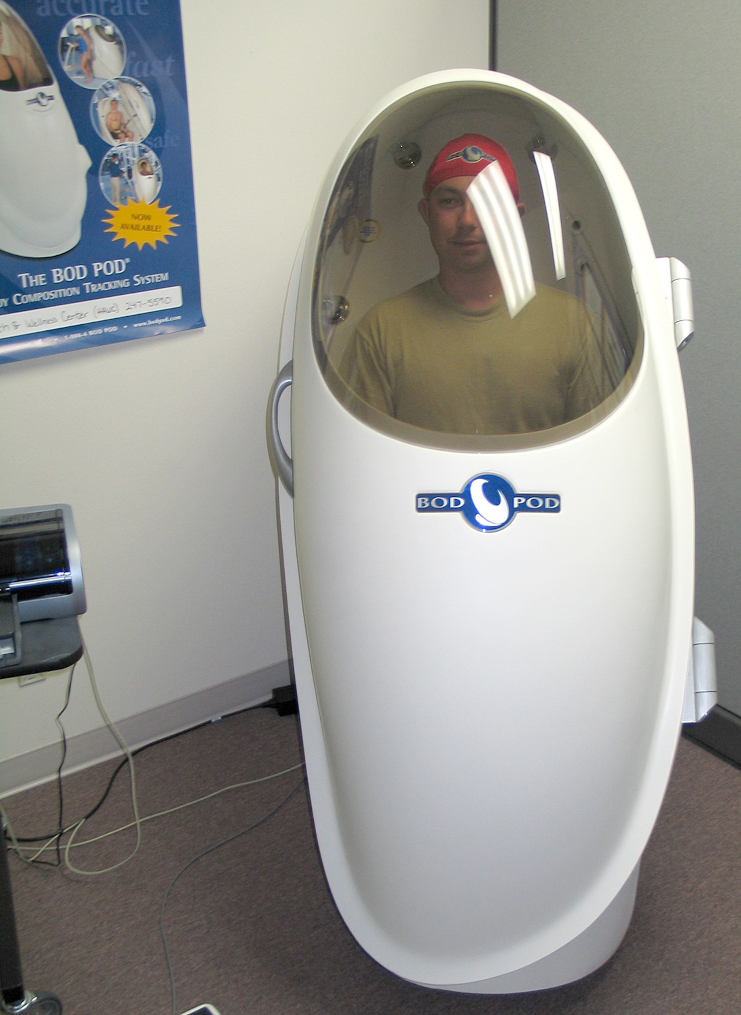 FAIRCHILD AIR FORCE BASE, Wash. – Staff Sgt. Mike Torrieri, health and wellness technician at the Health and Wellness Center here, demonstrates the Bod Pod Body Composition Tracking system, a machine that accurately measures a person’s body fat percentage. The body composition machine arrived at Fairchild in April, and has proven to be an efficient, accurate measurement device; the Pod measures body composition in 10 minutes or less. Though Fairchild is one of only 13 Air Force bases currently using the machine, Alyson Kresser, HAWC dietician, says she can “see the Bod Pod becoming more popular.” (U.S. Air Force photo / Staff Sgt. Connie L. Bias)