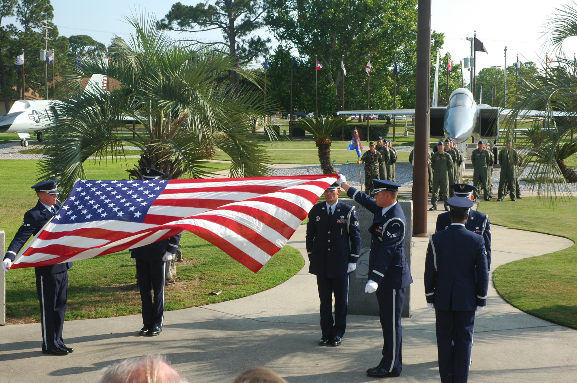 Members of the 95th Fighter Squadron stand in formation during a formal retreat ceremony held here May 30. The retreat ceremony was dedicated to all deceased members of the 95th Fighter Squadron.  A four-ship of F-15C Eagle aircraft from the 95th FS performed a missing-man flyby as attendees of the 2008 Bonehead Reunion reflected on the moment. (Photo by 1st Lt. Amanda Ferrell) 