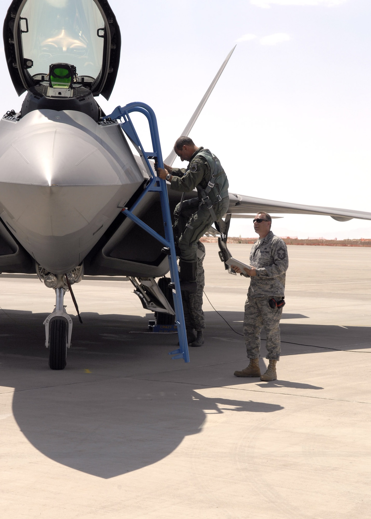 Col. Jeff Harrigian steps out of an F-22 Raptor June 2 at Holloman Air Force Base, N.M. The F-22 isnow assigned to Holloman AFB. Colonel Harrigan is the 49th Fighter Wing commander. (U.S. Air Force photo/Airman 1st Class Rachel A. Kocin)