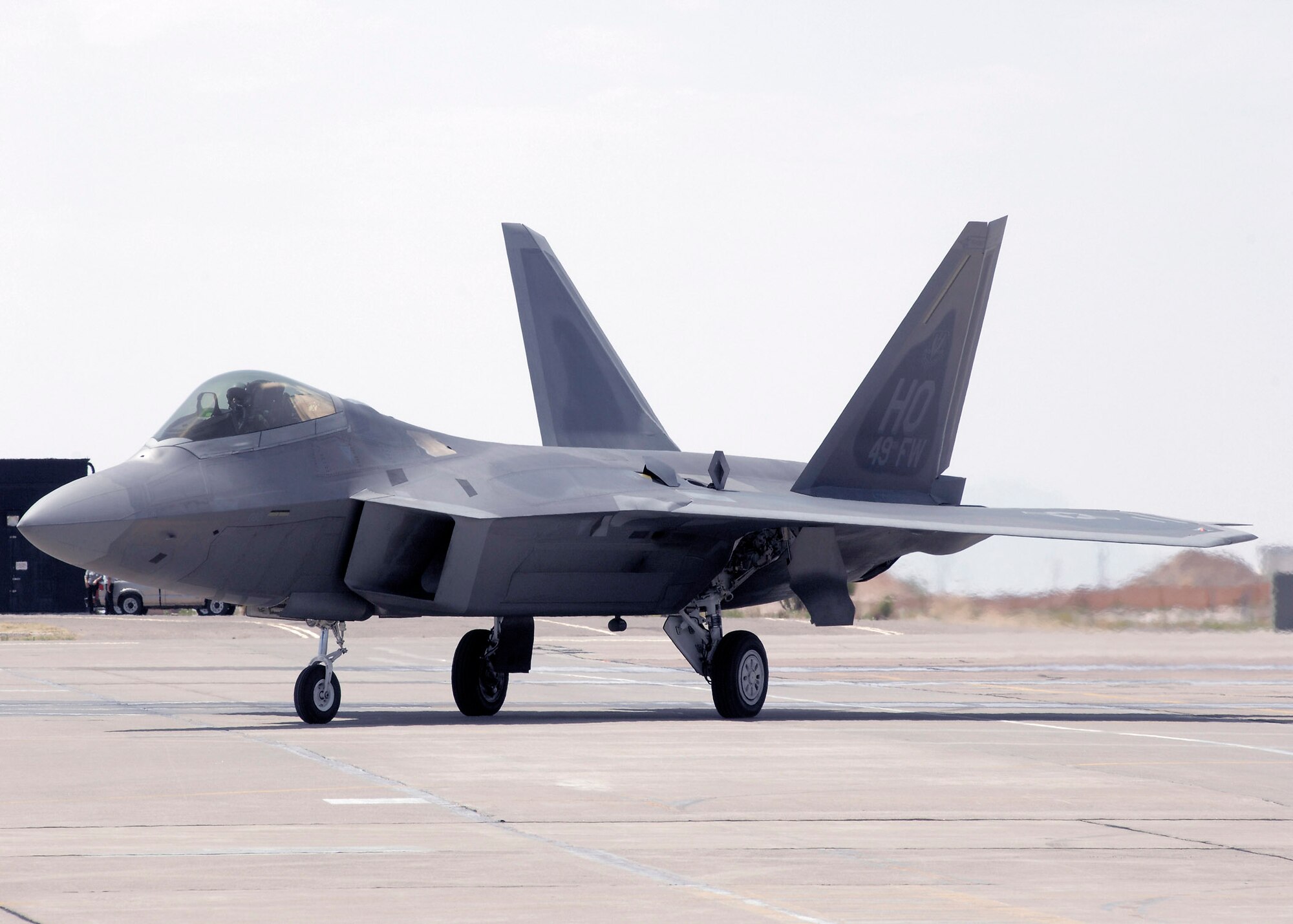 An F-22 Raptor flown by Col. Jeff Harrigian arrives June 2 at Holloman Air Force Base, N.M., where it is now assigned. Colonel Harrigian is the 49th Fighter Wing commander. (U.S. Air Force photo/Airman 1st Class Rachel A. Kocin) 