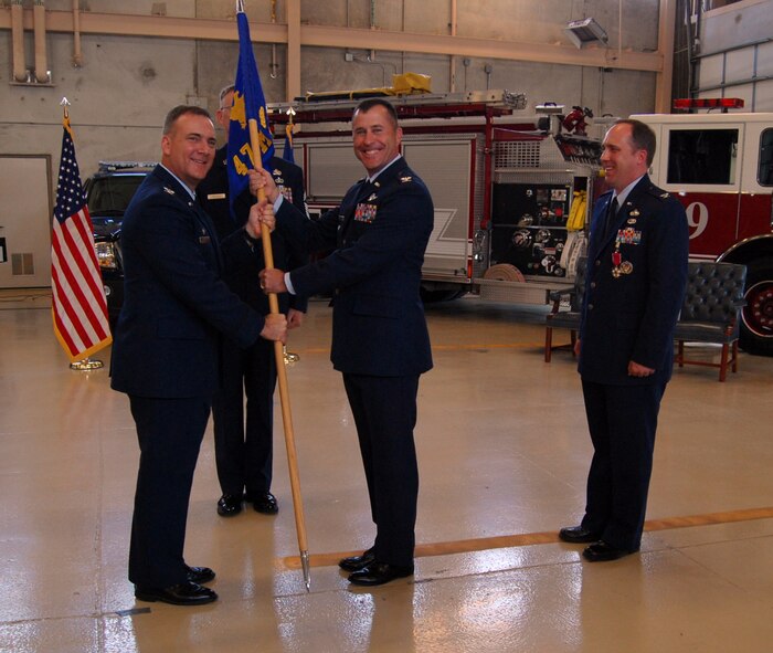 Col. Andrew Cernicky (center) accepts command of the 47th Mission Support Group from Col. John Doucette (left), 47th Flying Training Wing commander, while Col. Roger Thrasher (right) looks on, during a May 29 ceremony in Laughlin’s fire station.  