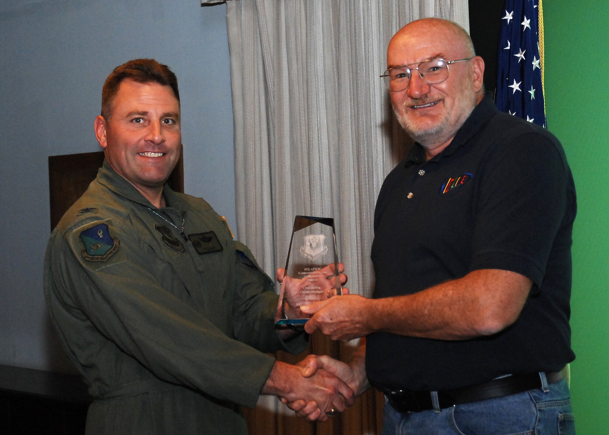 CANNON AIR FORCE BASE, N.M. --  Gary Zoelzer, 27th Special Operations Communications Squadron, receives the Outstanding Civilian Manager Award presented by Col. Timothy Leahy, 27th Special Operations Wing commander.  Mr. Zoelzer received the award at the weekly wing staff meeting on June 4.  (U.S. Air Force photo/Senior Airman Liliana Moreno)